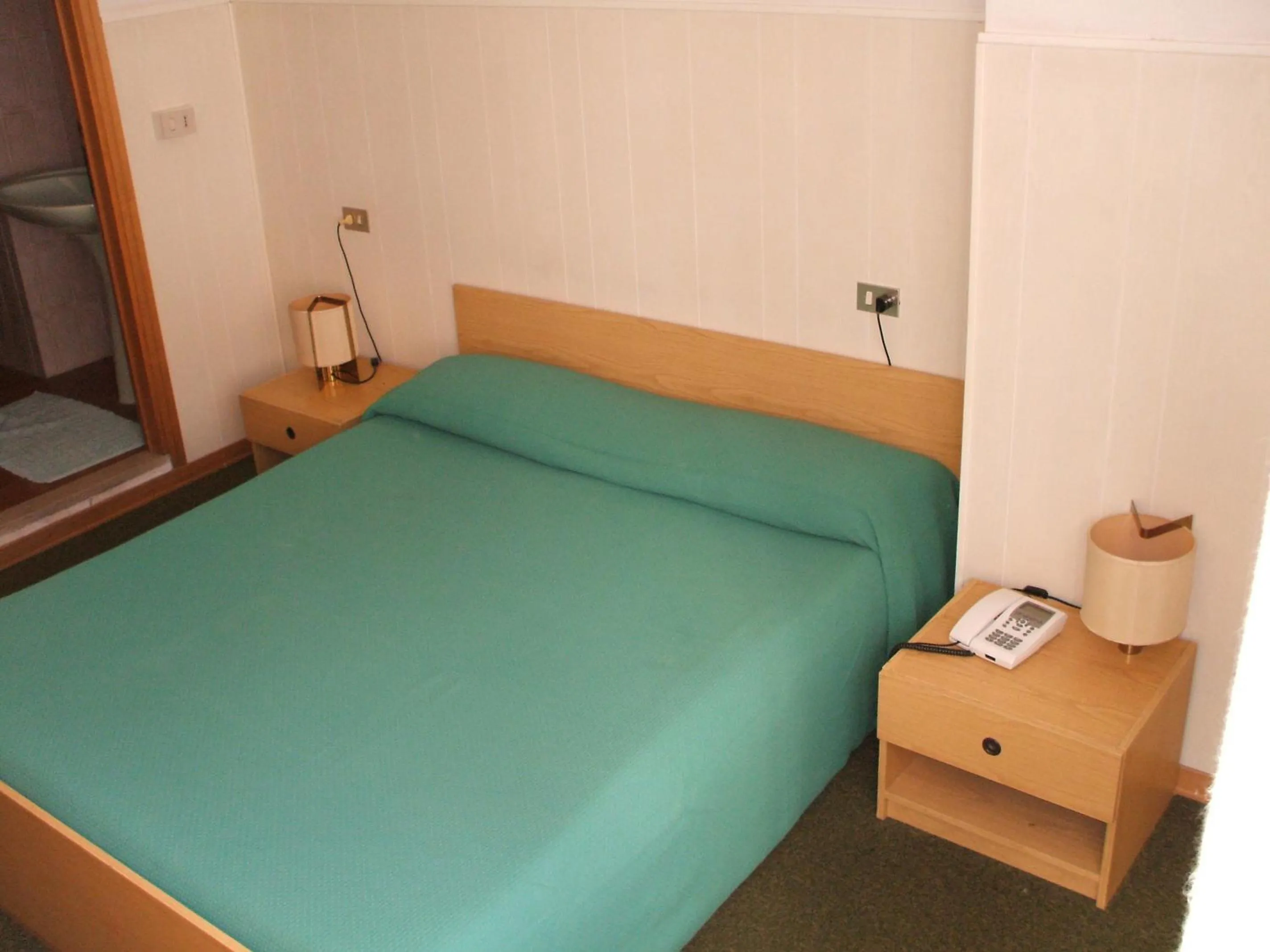 Bed in Hotel Cucciolo