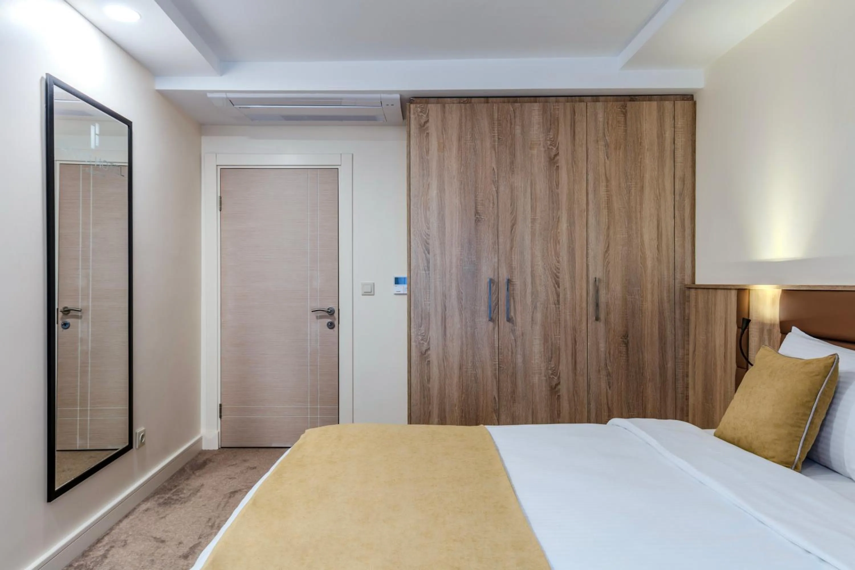 Bed in Roys Hotel & Suites