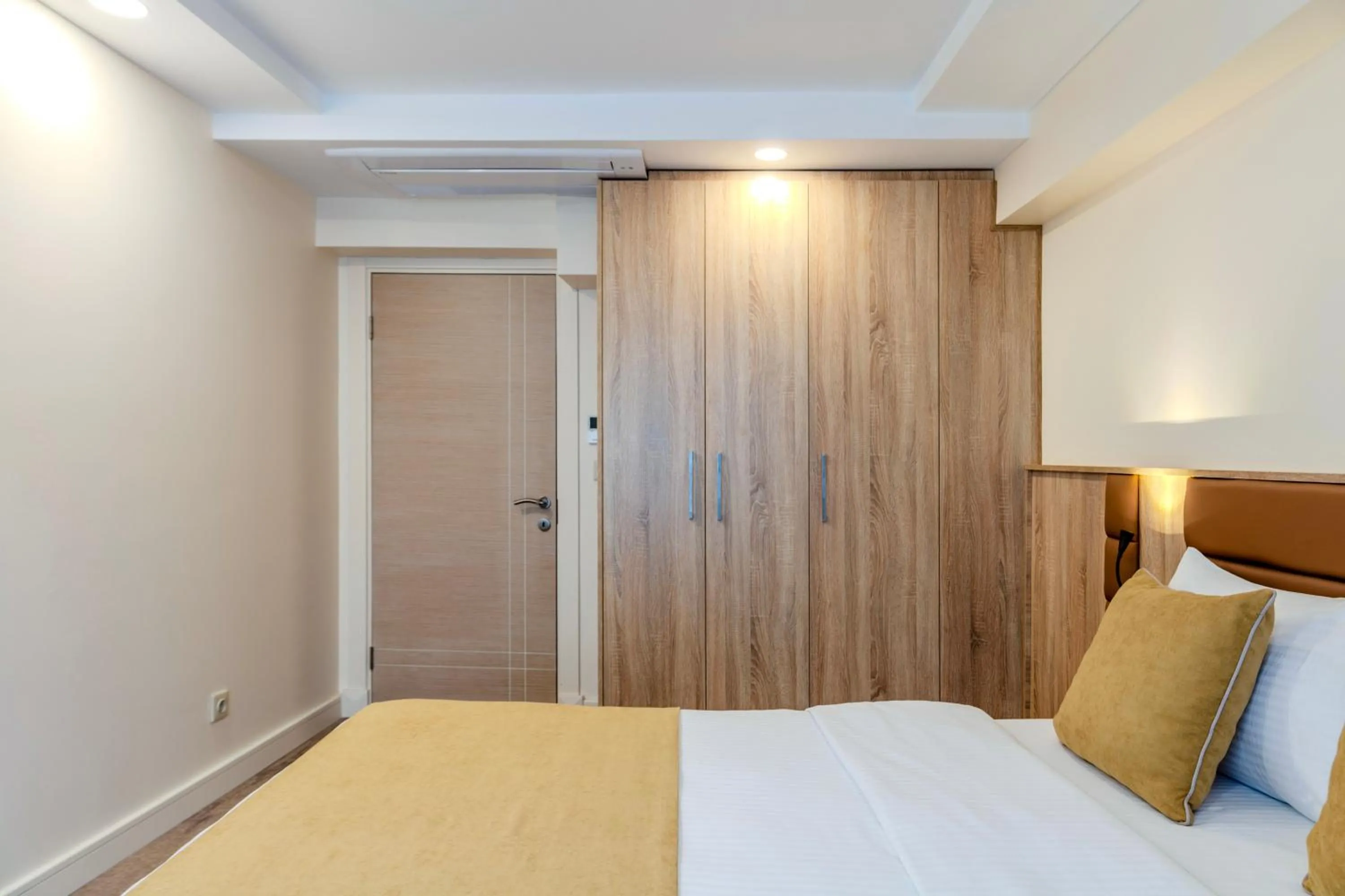 Bed in Roys Hotel & Suites