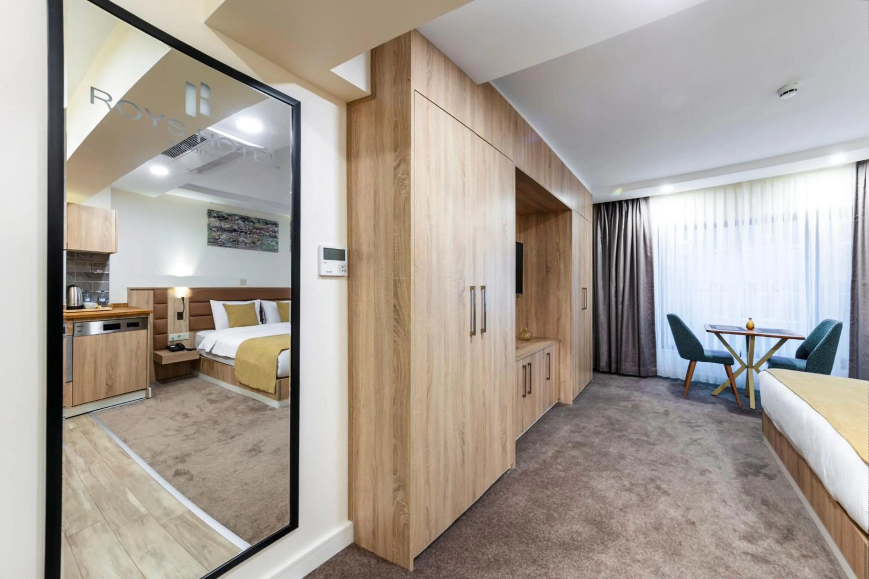 Bed in Roys Hotel & Suites