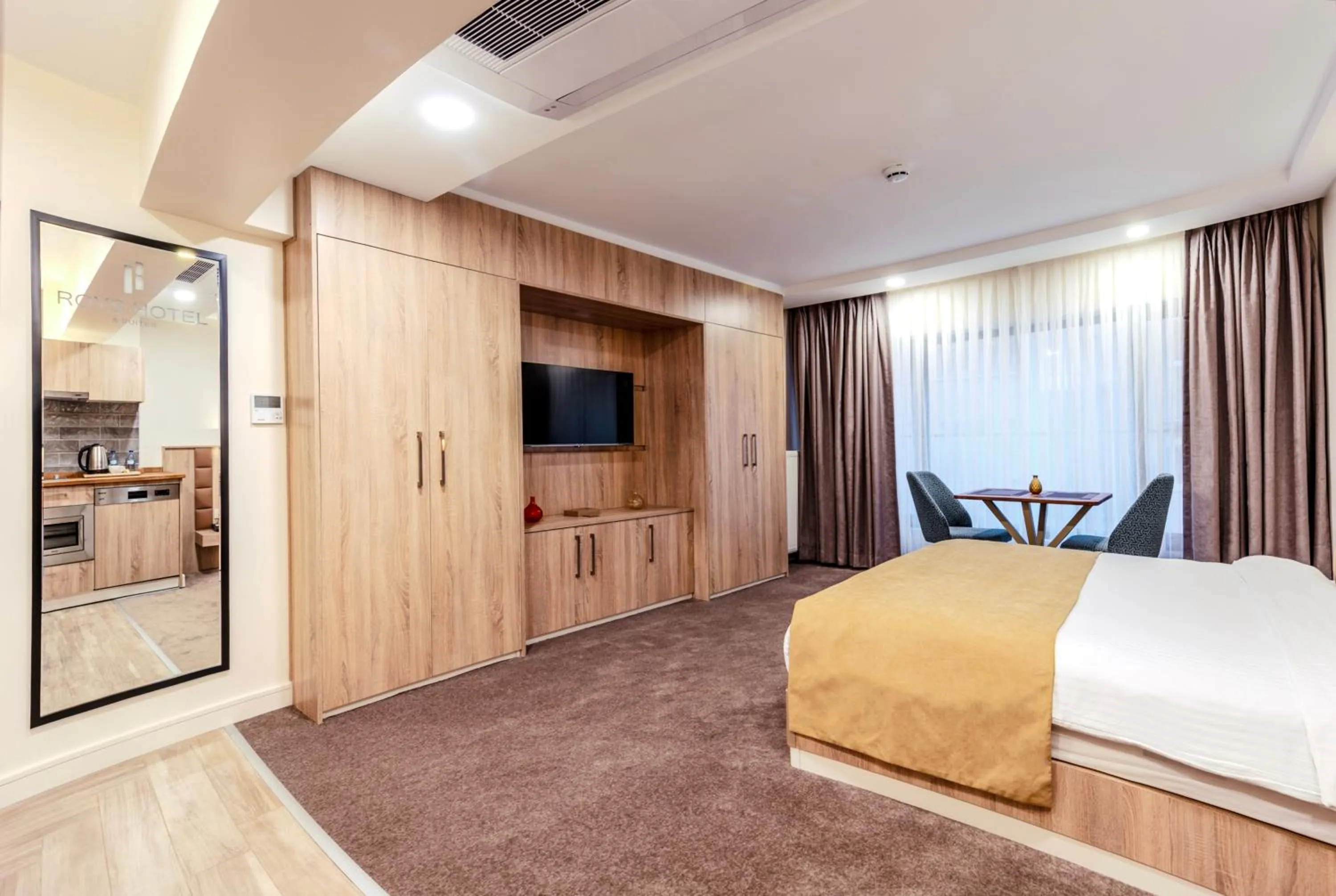 Bed in Roys Hotel & Suites