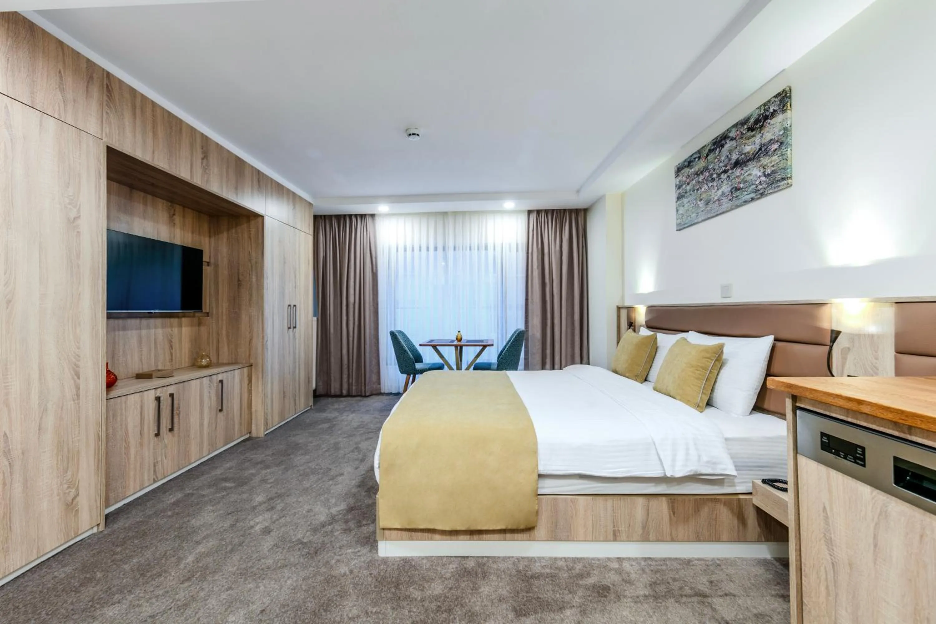 Bed in Roys Hotel & Suites