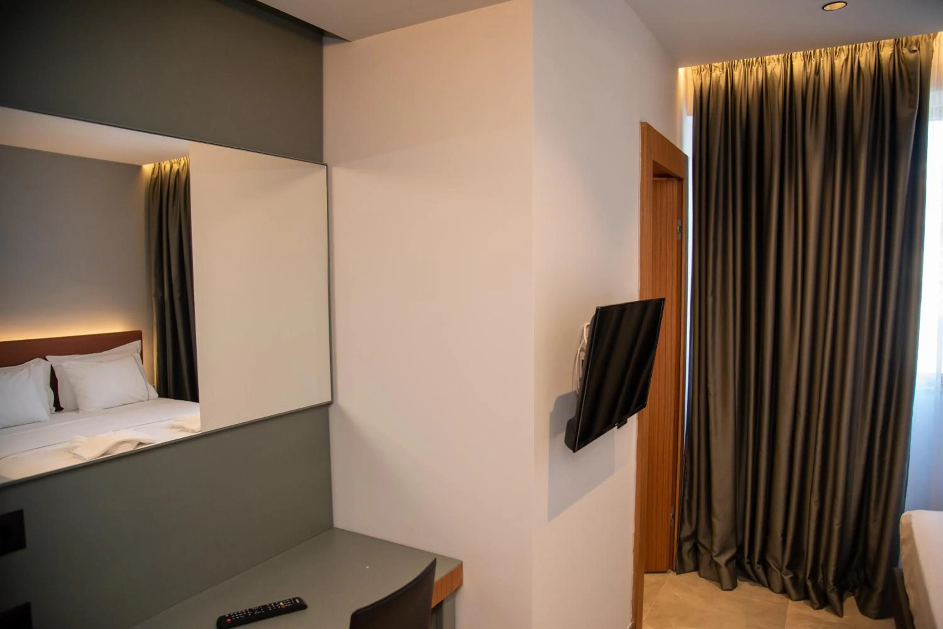 Communal lounge/ TV room, Bed in Adria Palace