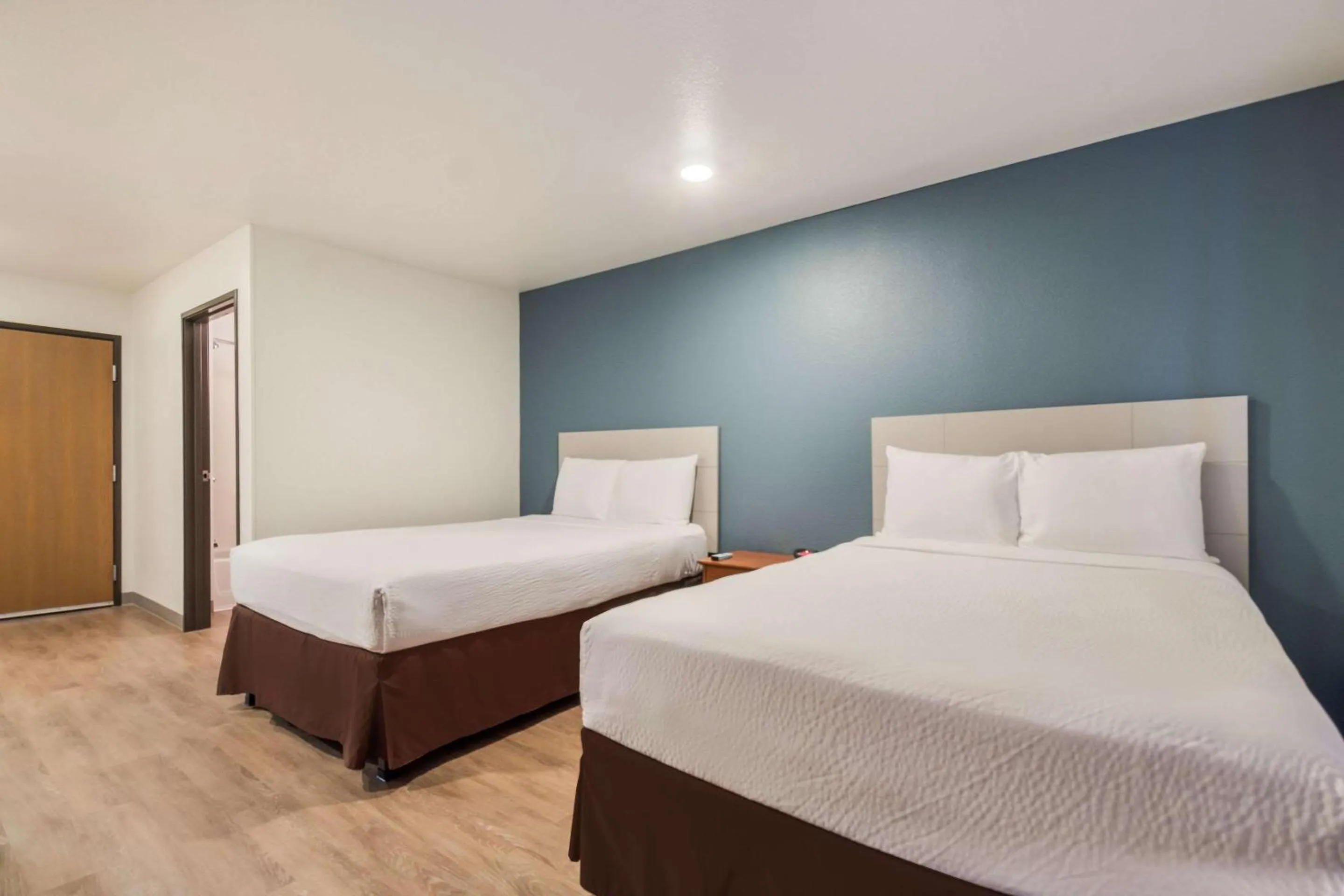 Photo of the whole room, Bed in WoodSpring Suites Houston La Porte