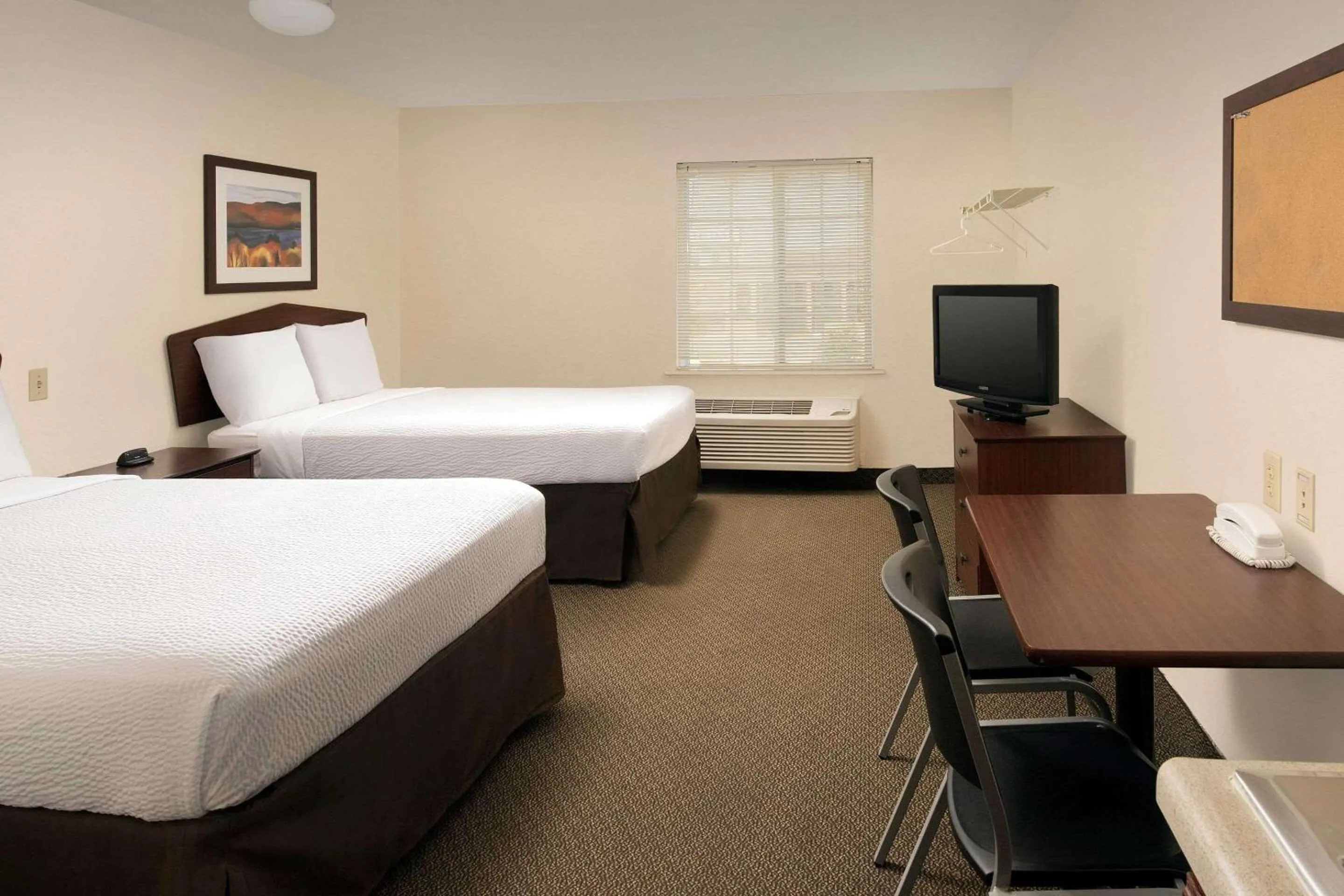 Photo of the whole room, Bed in WoodSpring Suites San Antonio Fort Sam