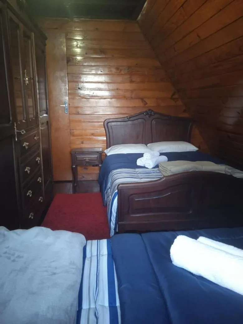 Bed in Pousada Chale Pico da Bandeira