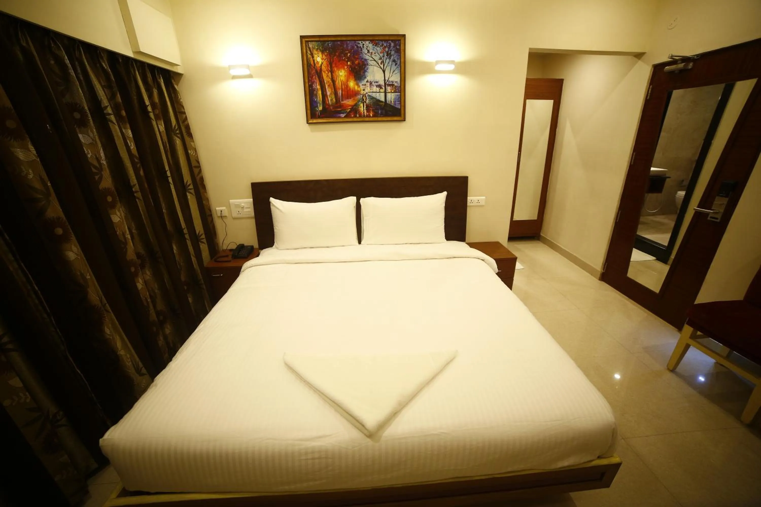 Bedroom in Hotel skml Grand