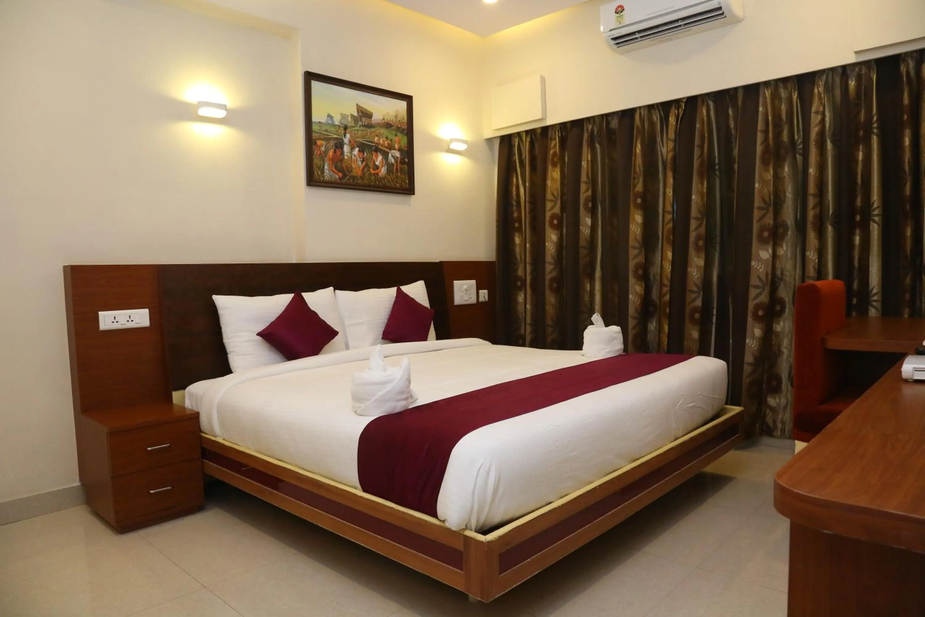 Bedroom in Hotel skml Grand