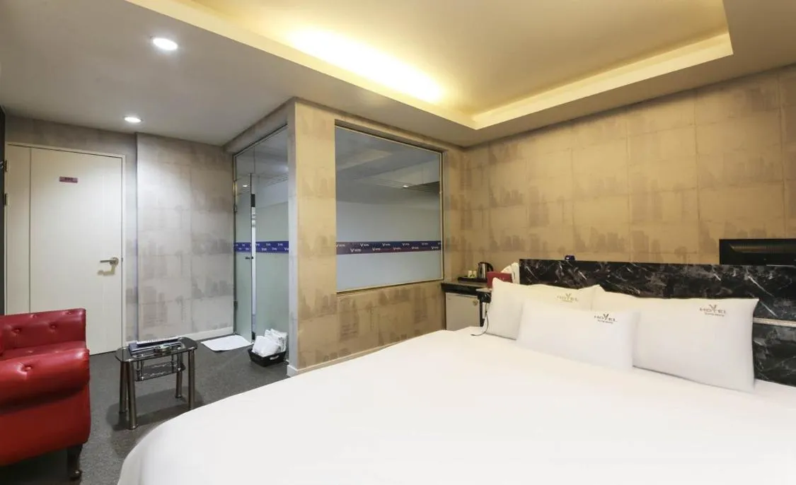 Bed in Songjeong V Hotel