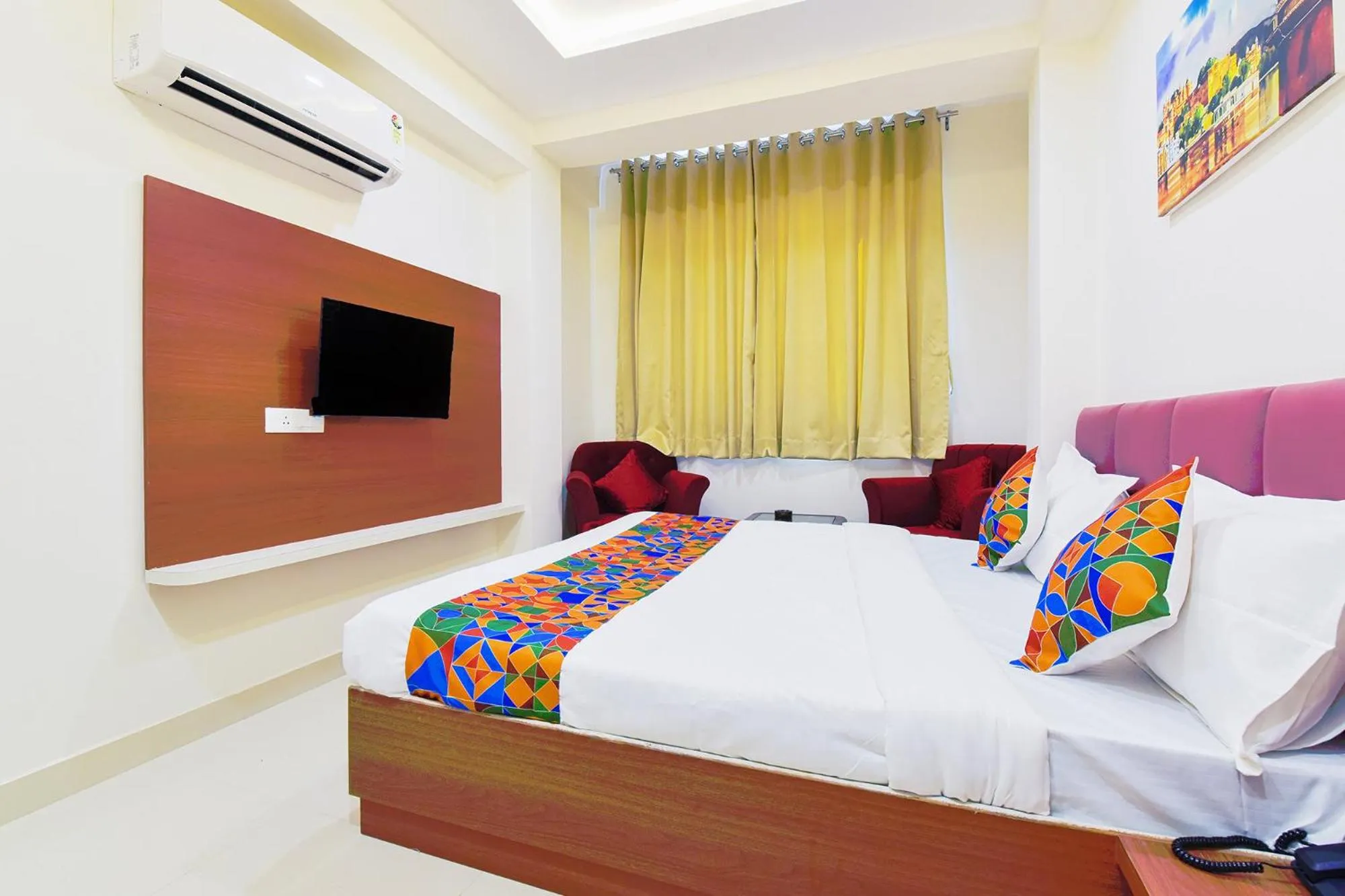 Bed in FabHotel Samrat Regency