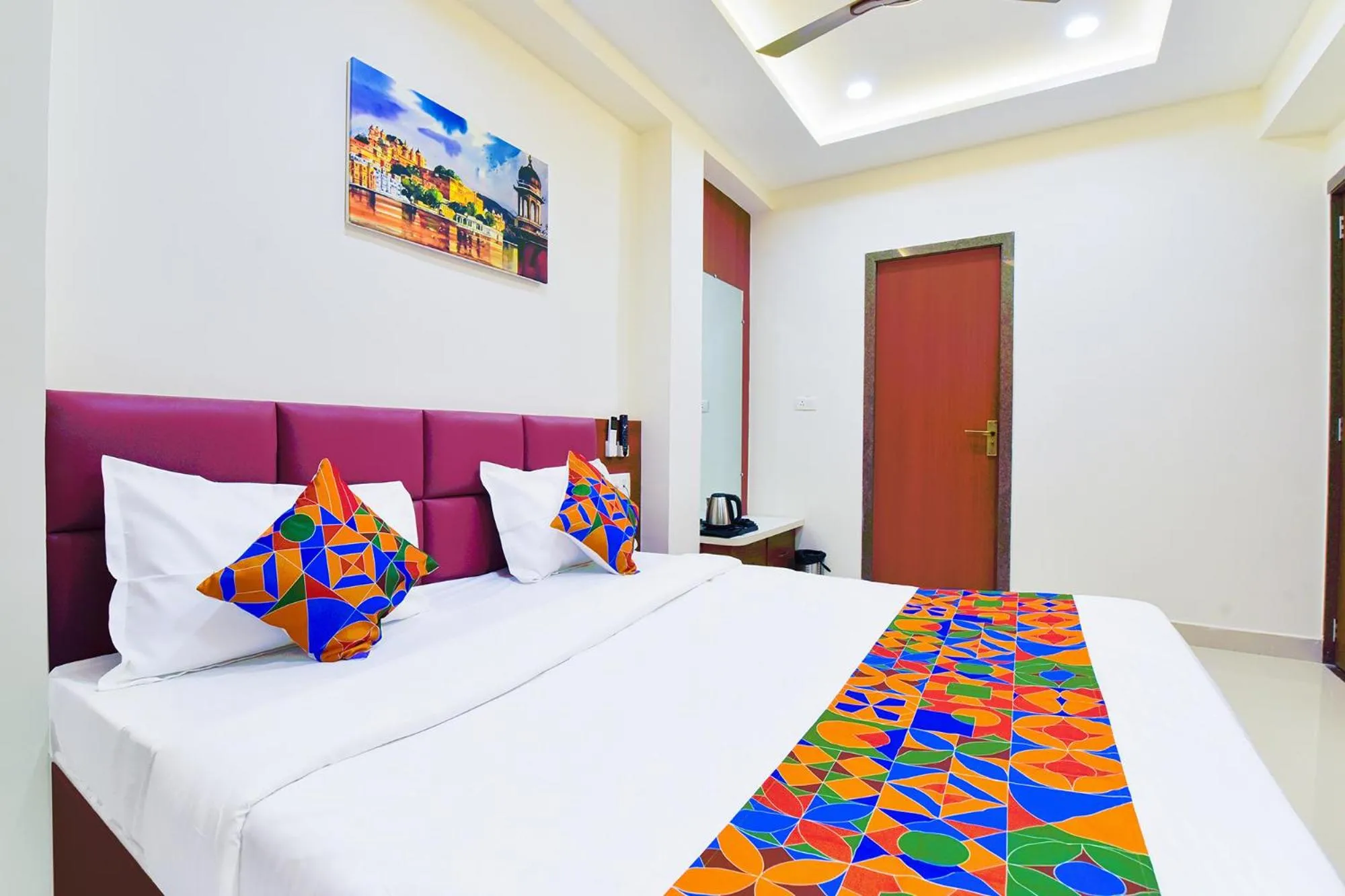 Bed in FabHotel Samrat Regency