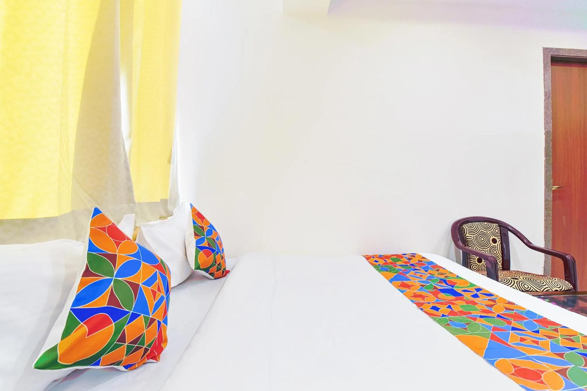 Bed in FabHotel Samrat Regency