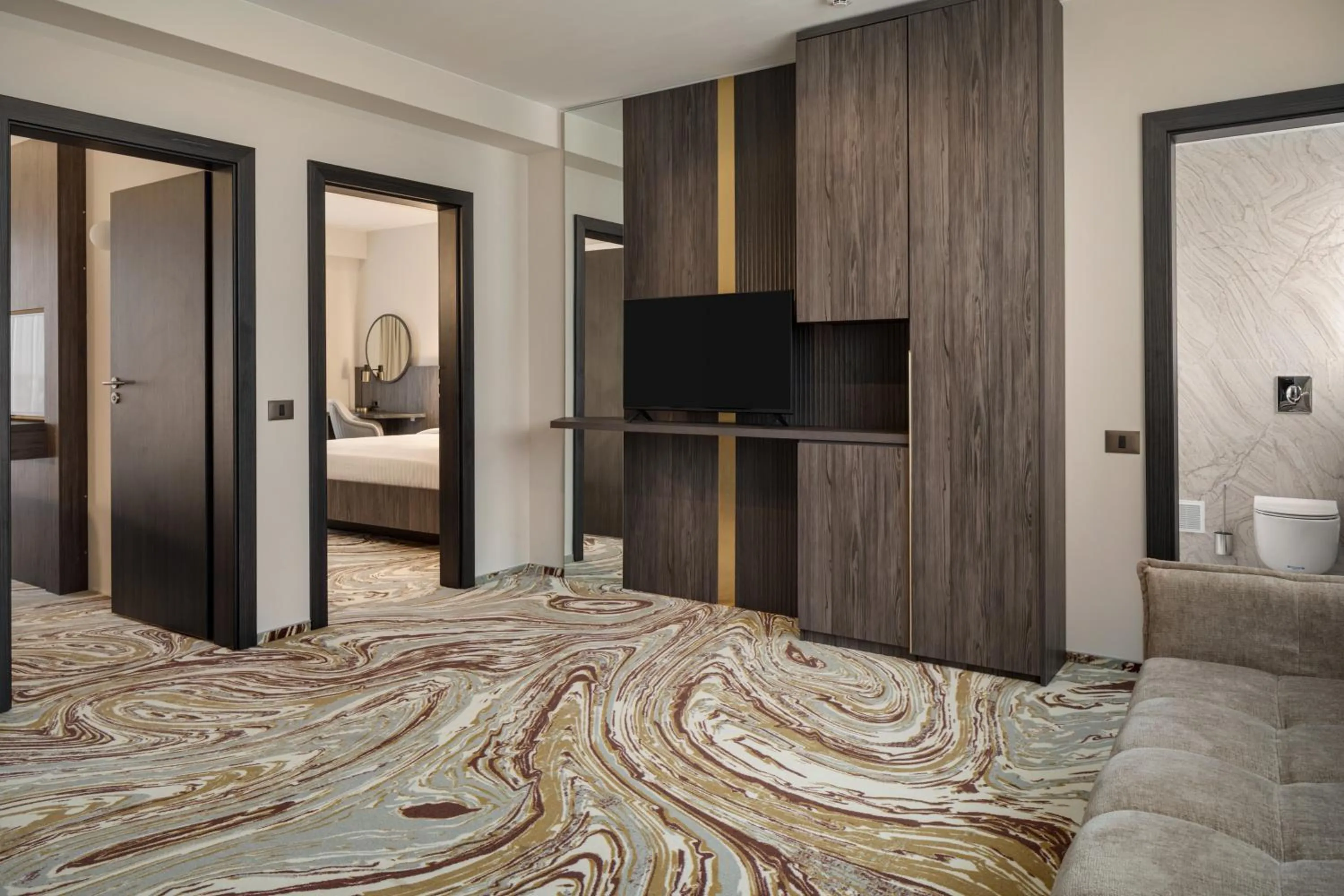 Living room, Bed in Ramada by Wyndham Bucharest Otopeni Airport