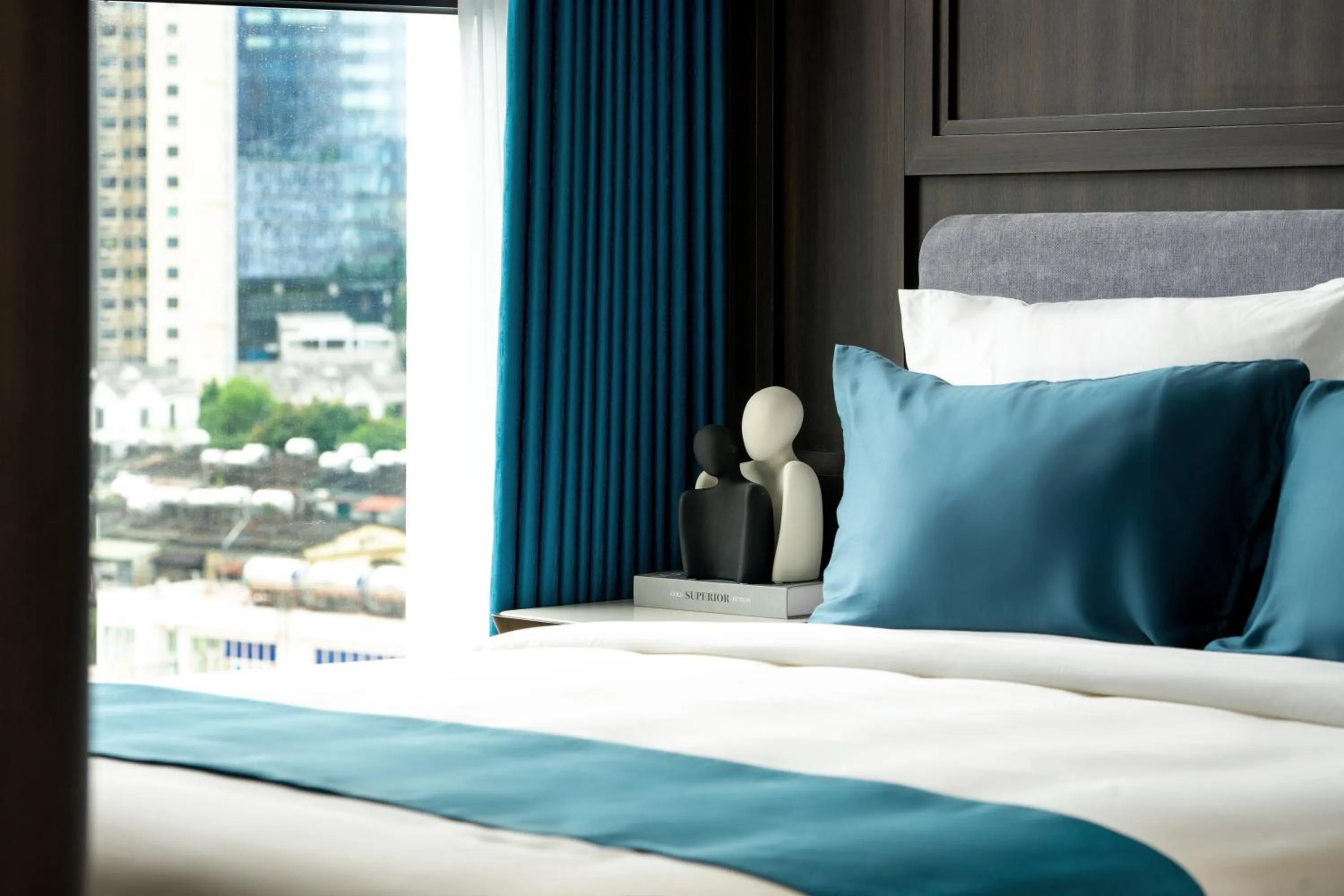 Bed in The Gloria Serviced Apartment by Silk Path