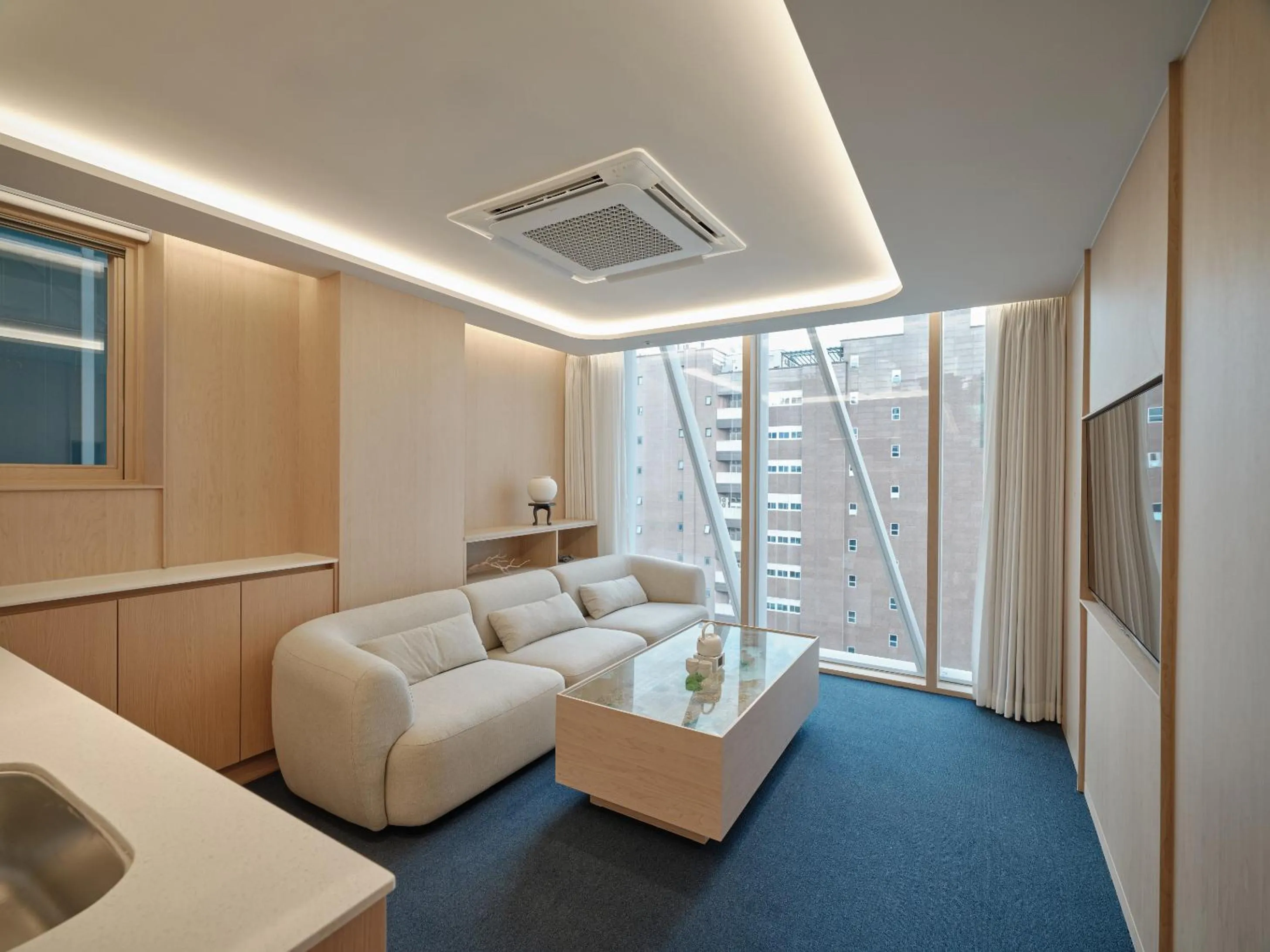 Living room, Bed in UH Suite The Gangnam