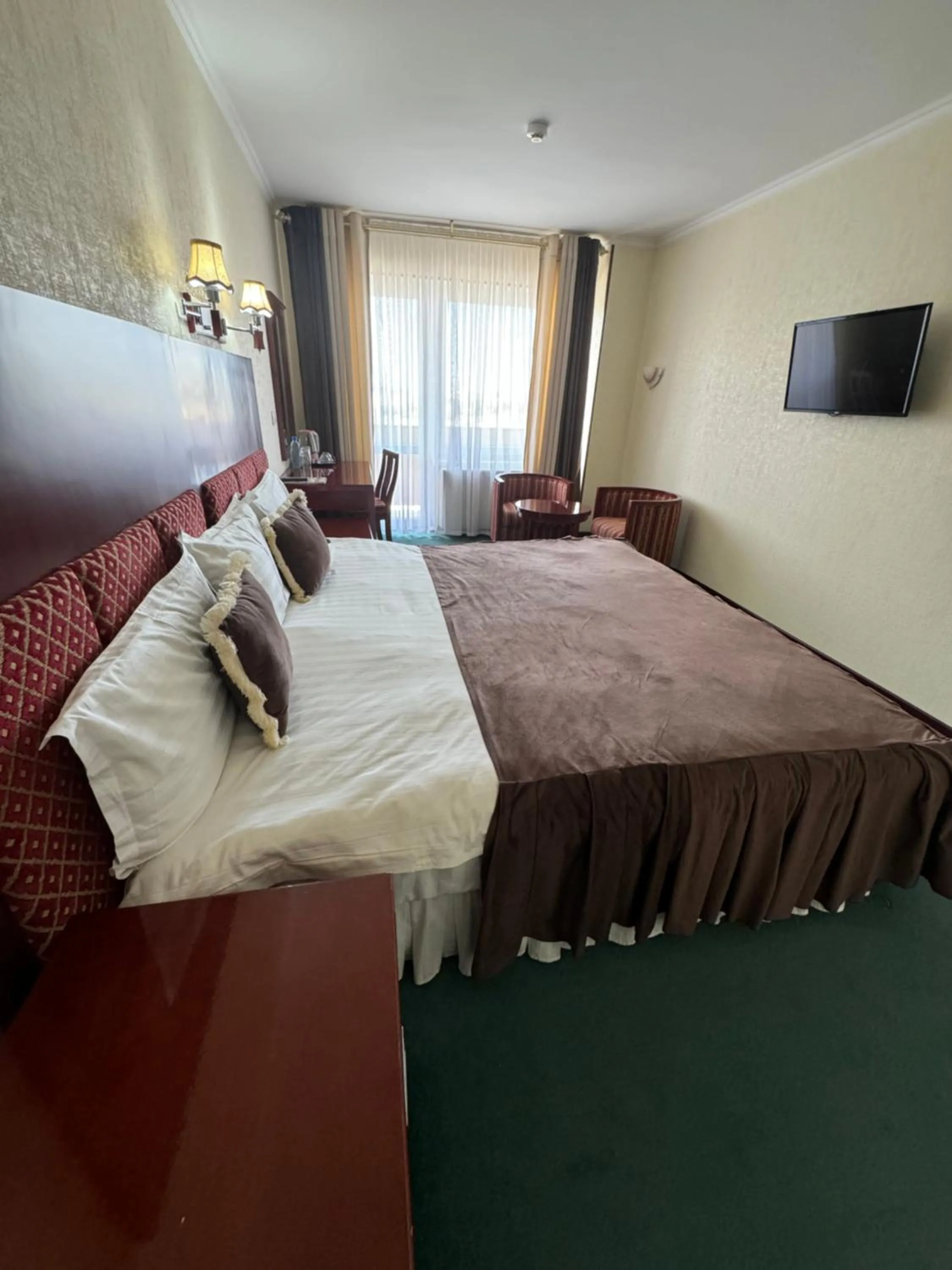 Bed in Hotel Grand Bukhara