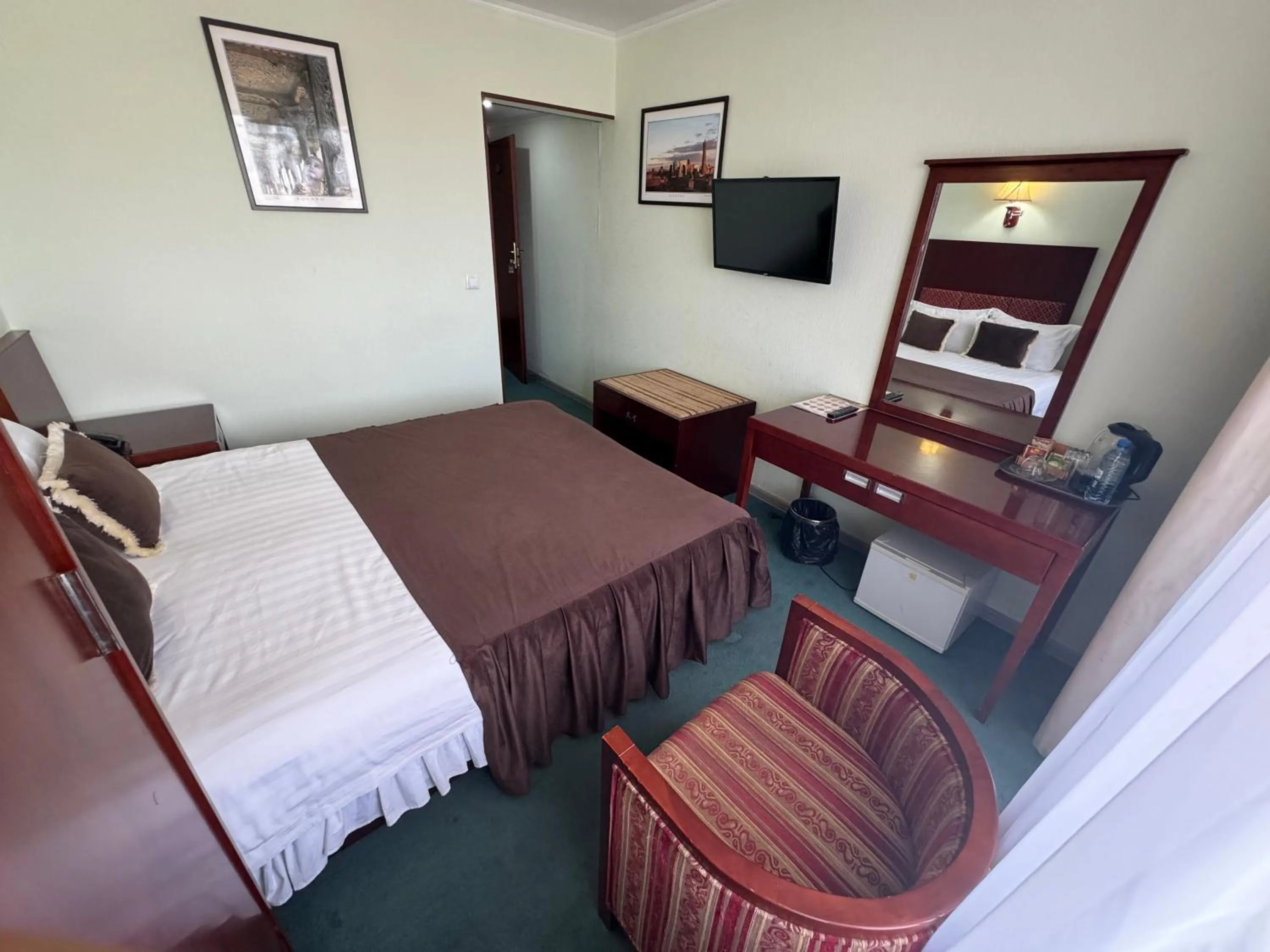 Bed in Hotel Grand Bukhara