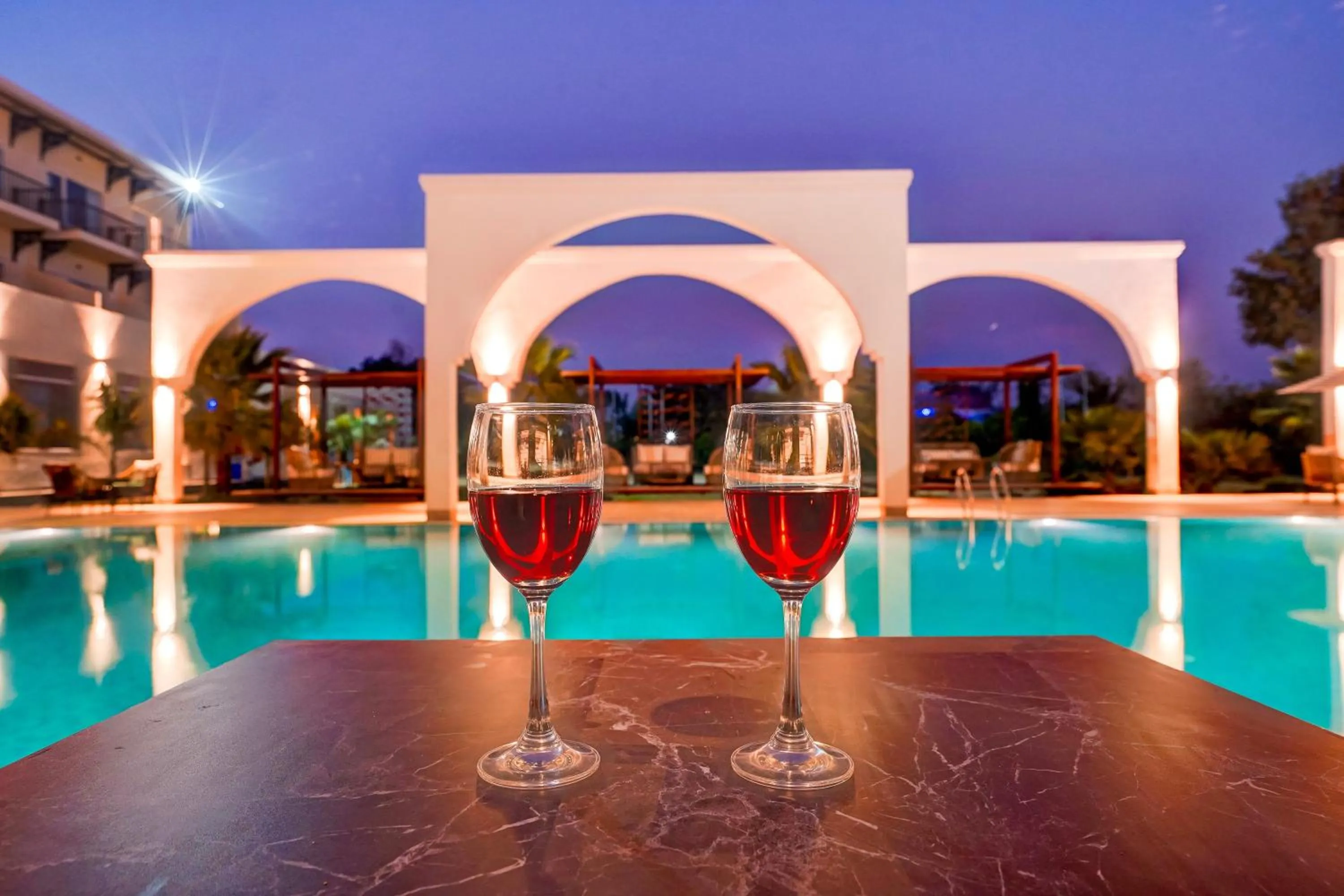 Swimming pool in Sunday Resort & Spa by CheckIn Manesar Gurugram