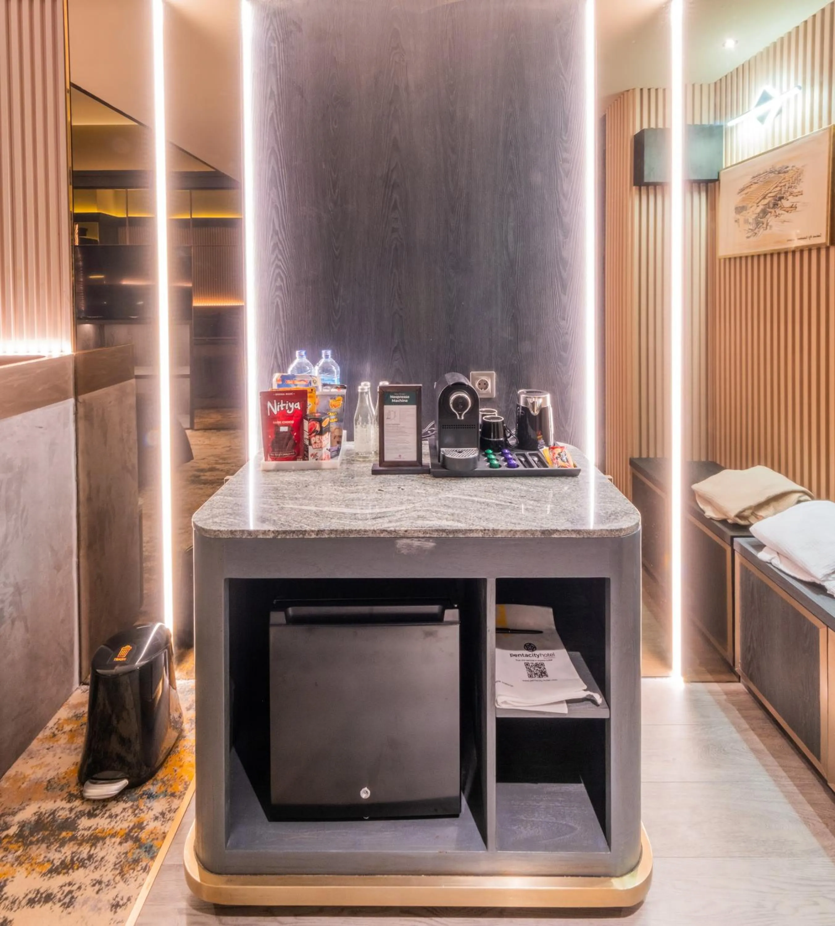 Coffee/tea facilities, Bed in The All - Suite Pentacity Hotel Balikpapan