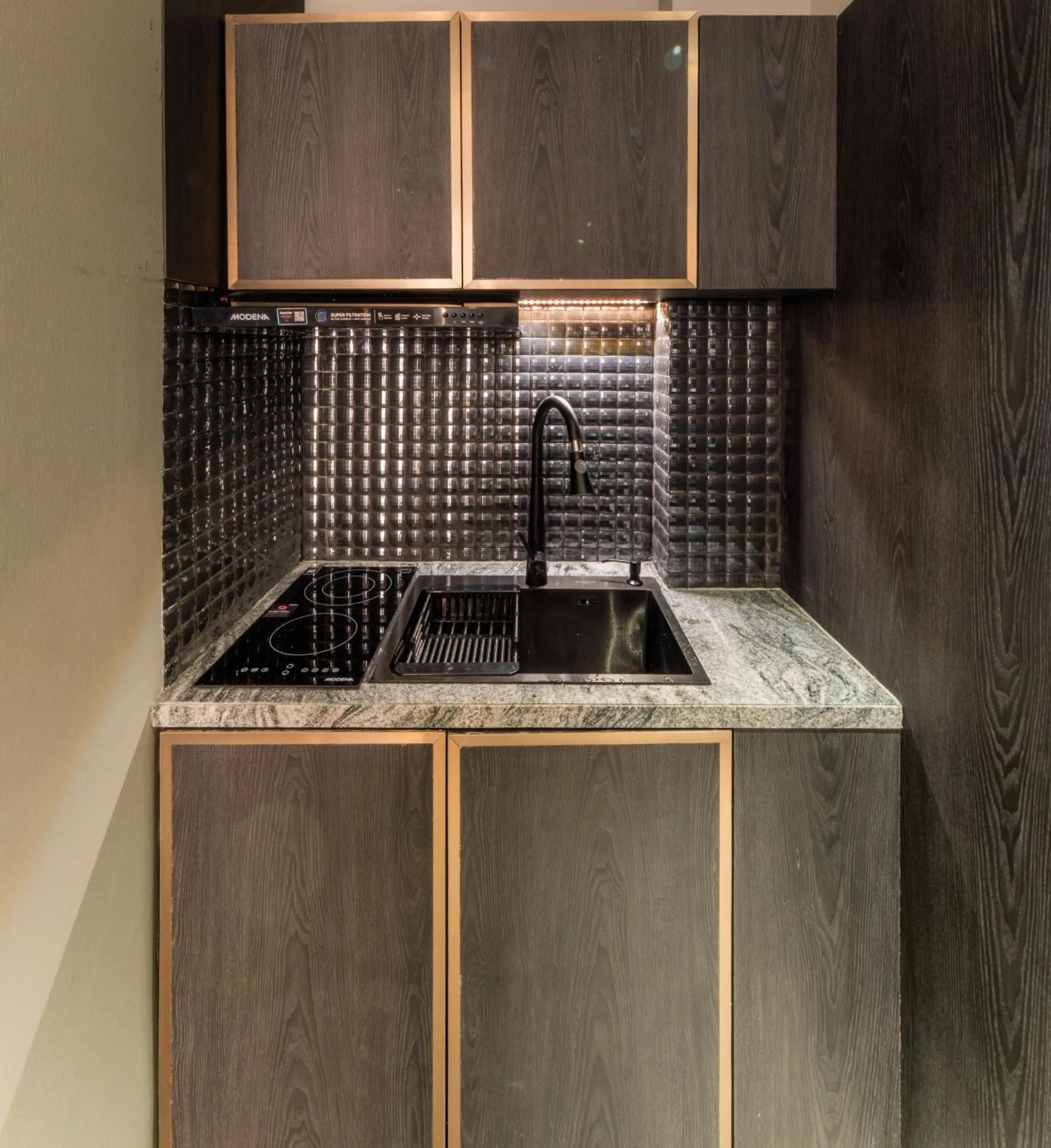 Kitchen or kitchenette in The All - Suite Pentacity Hotel Balikpapan