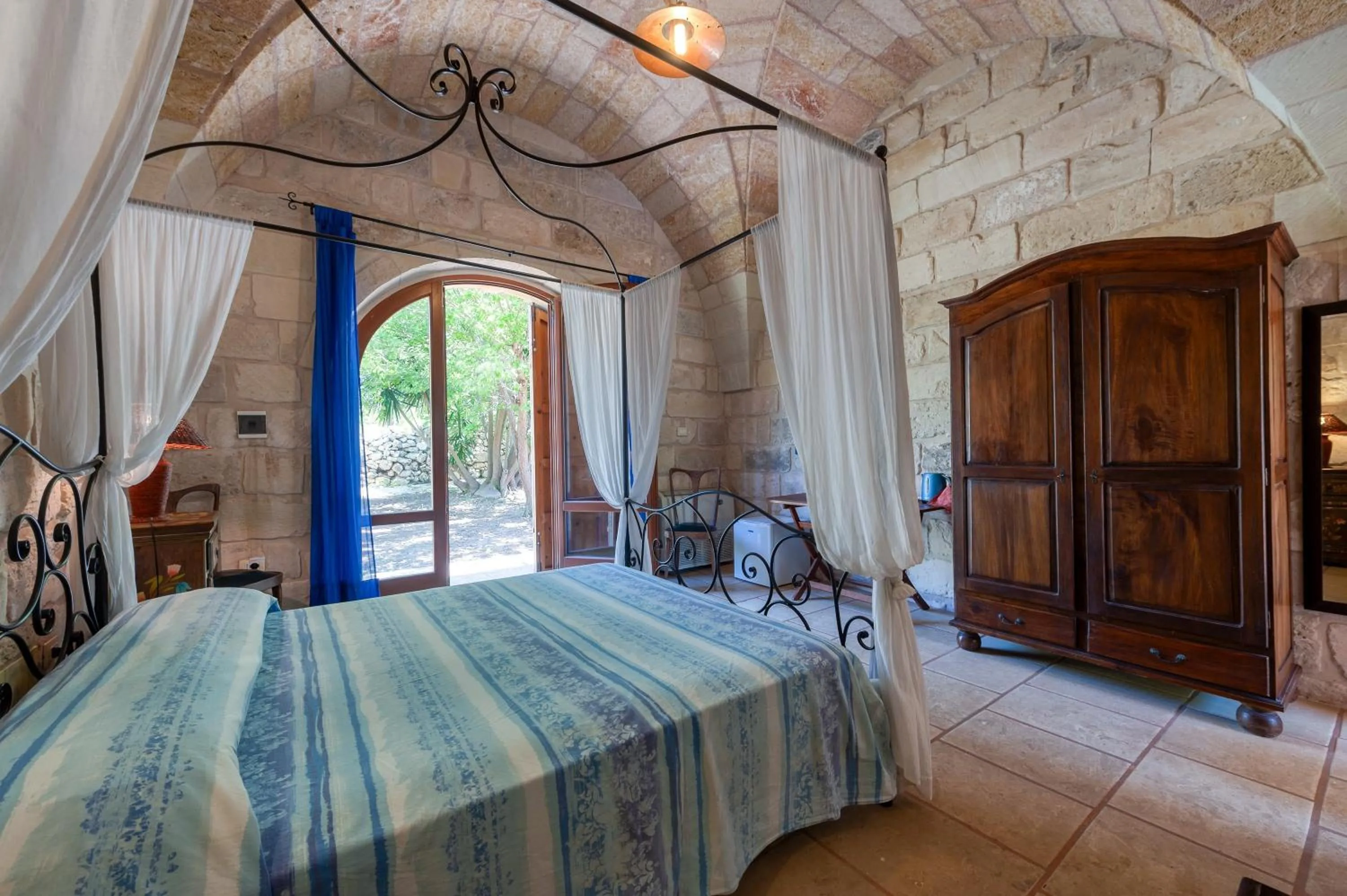 Living room, Bed in Masseria Copertini