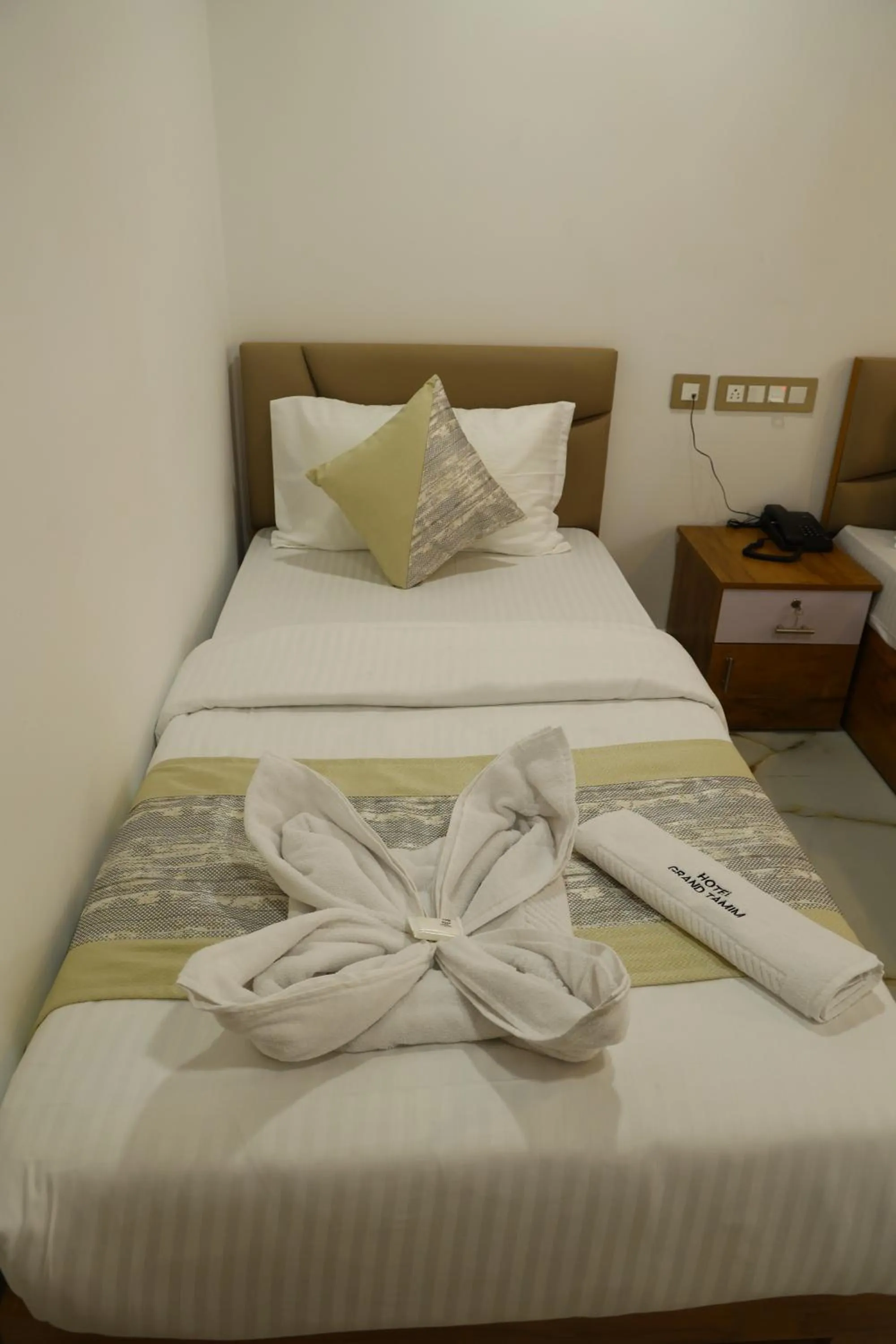 Bed in Grand Tamim Hotel