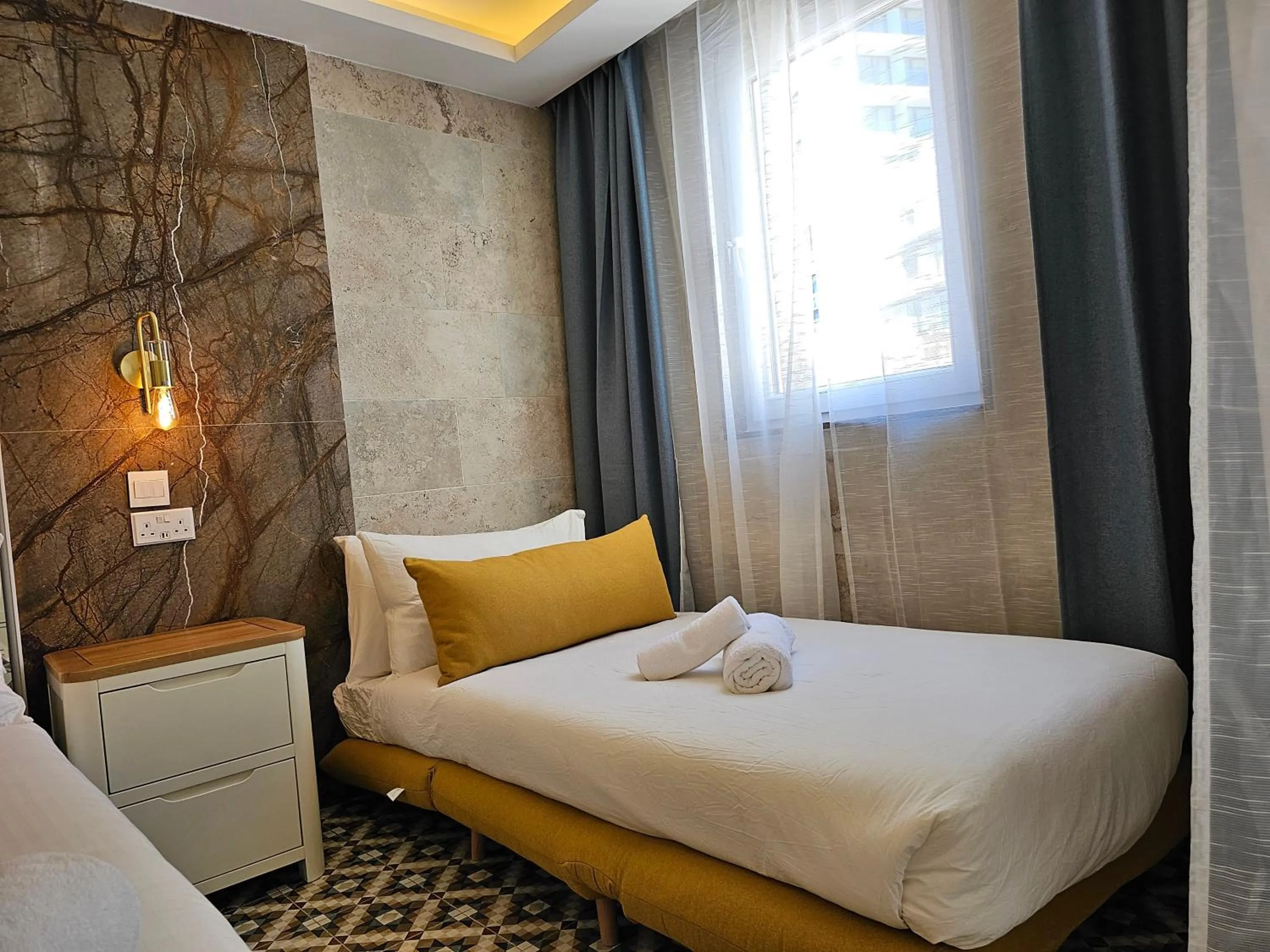 Bed in Balcony Hotel