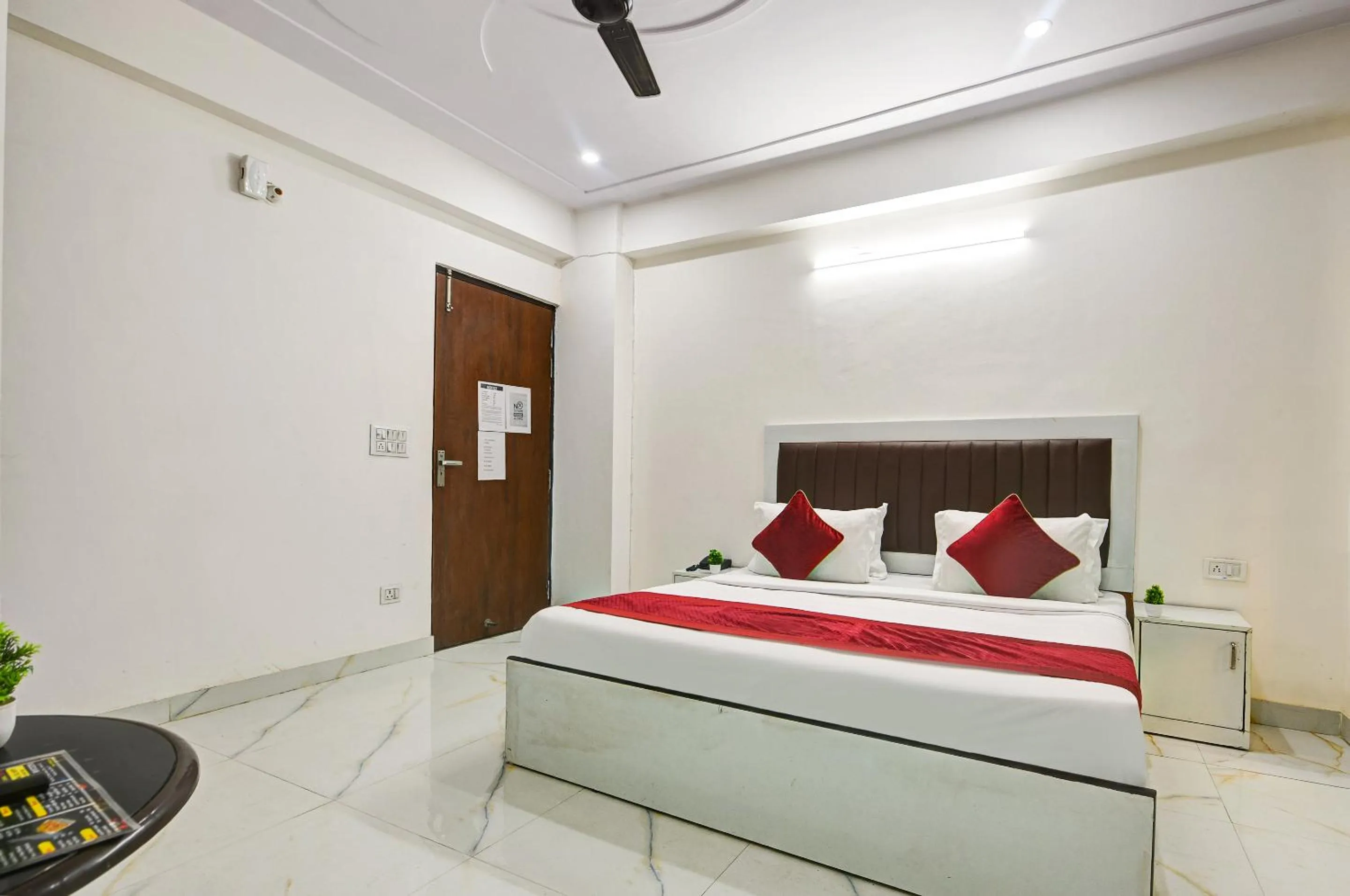 Bed in Hotel Krishna Tower