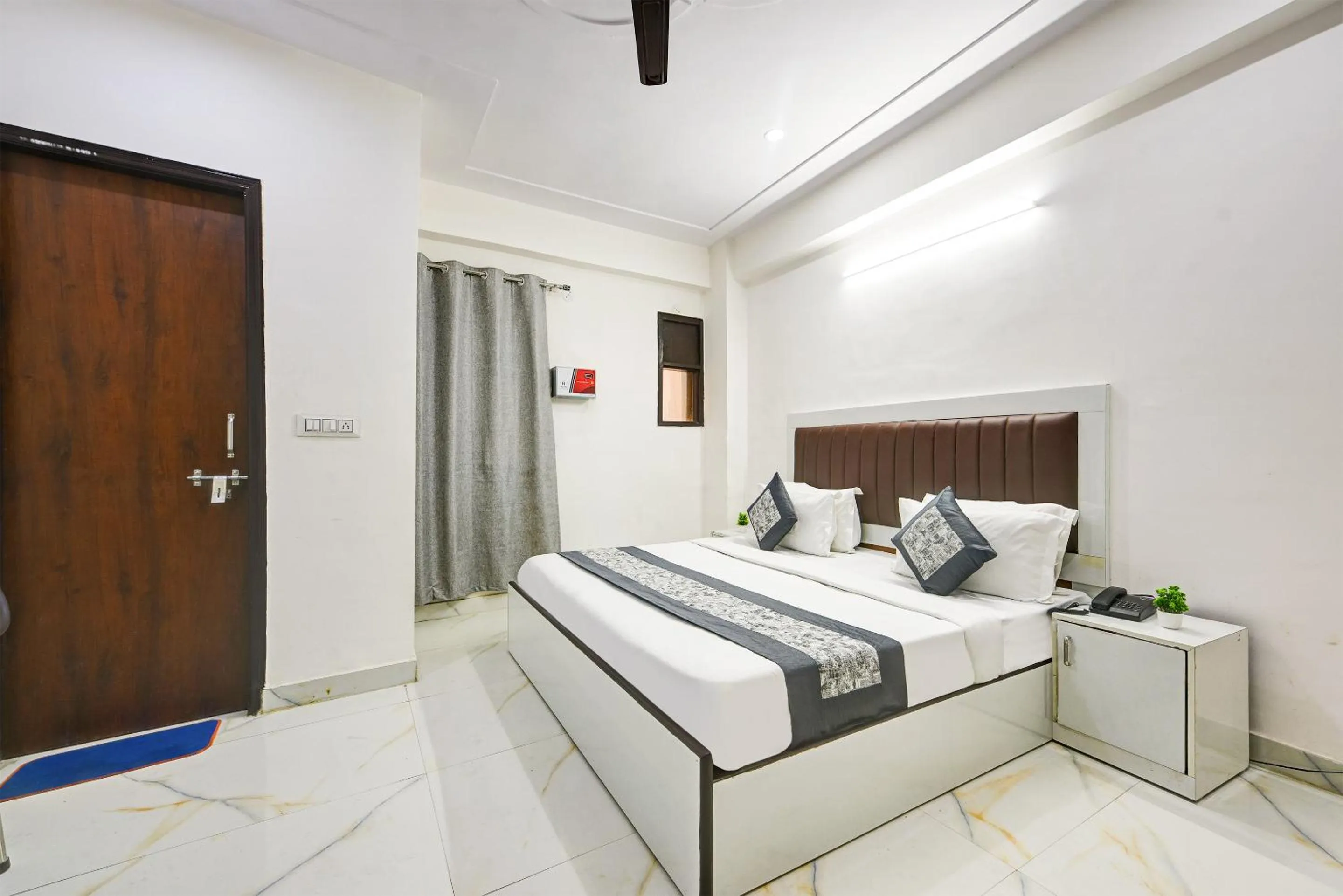 Bed in Hotel Krishna Tower