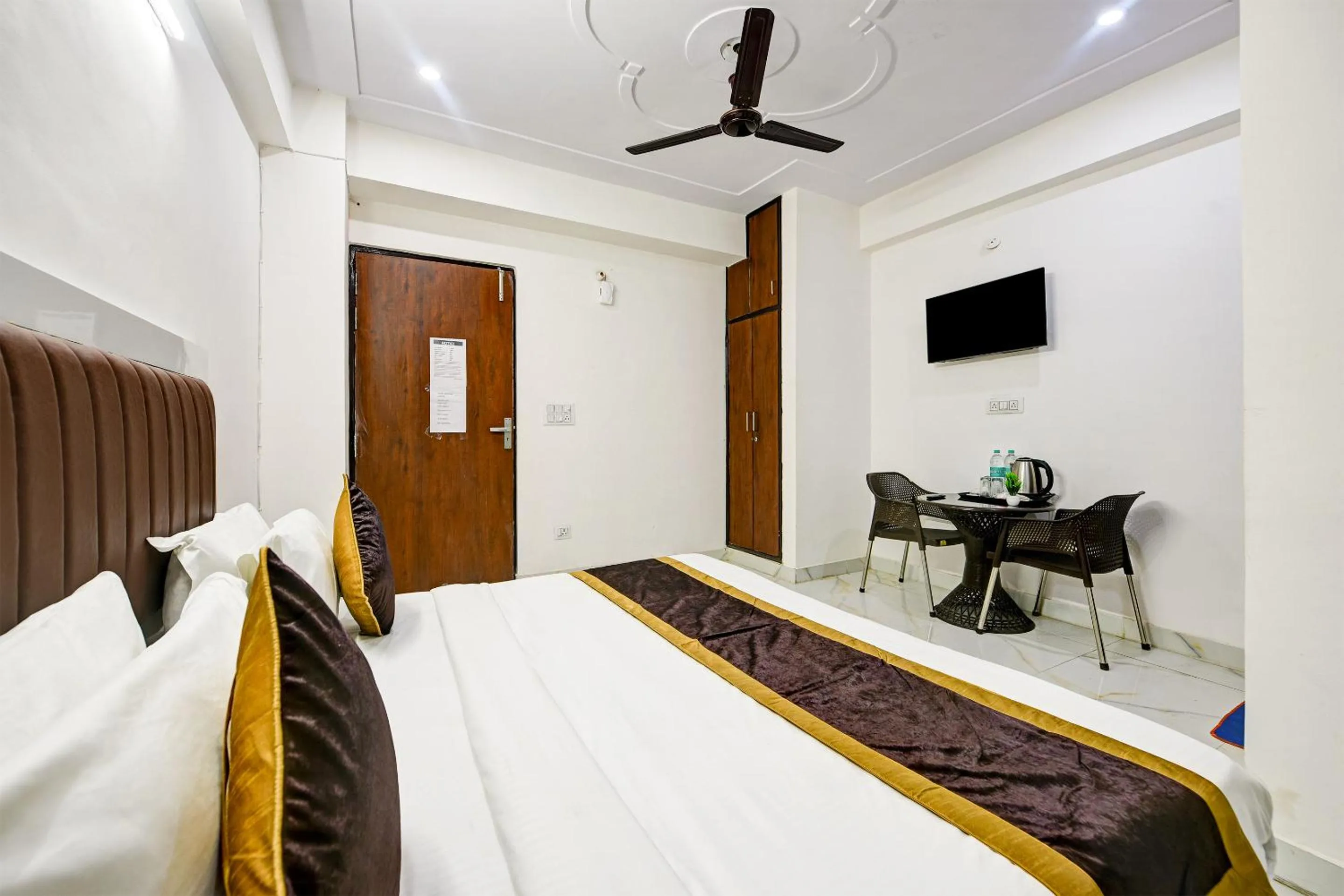 Bed in Hotel Krishna Tower