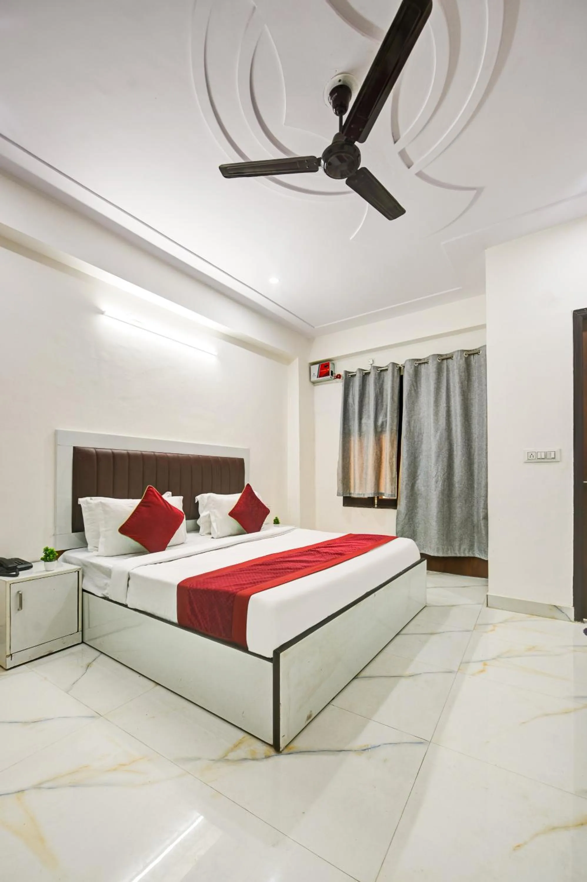 Bed in Hotel Krishna Tower