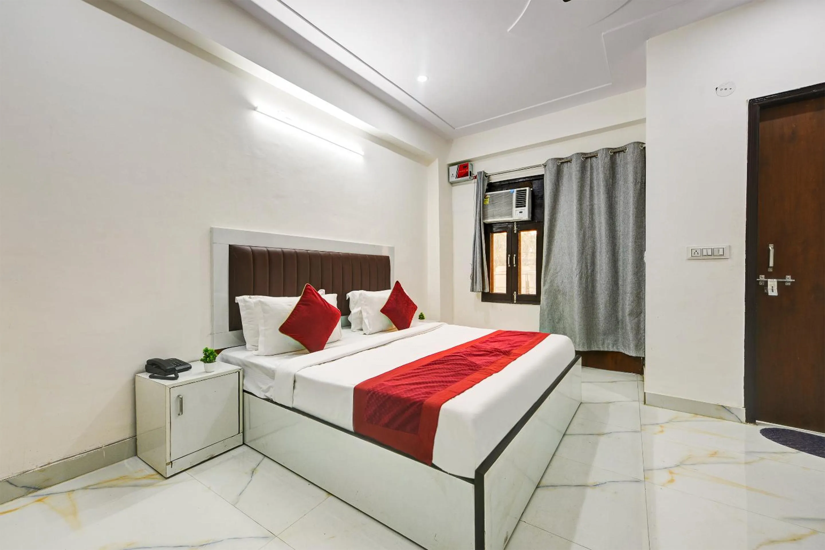 Bed in Hotel Krishna Tower