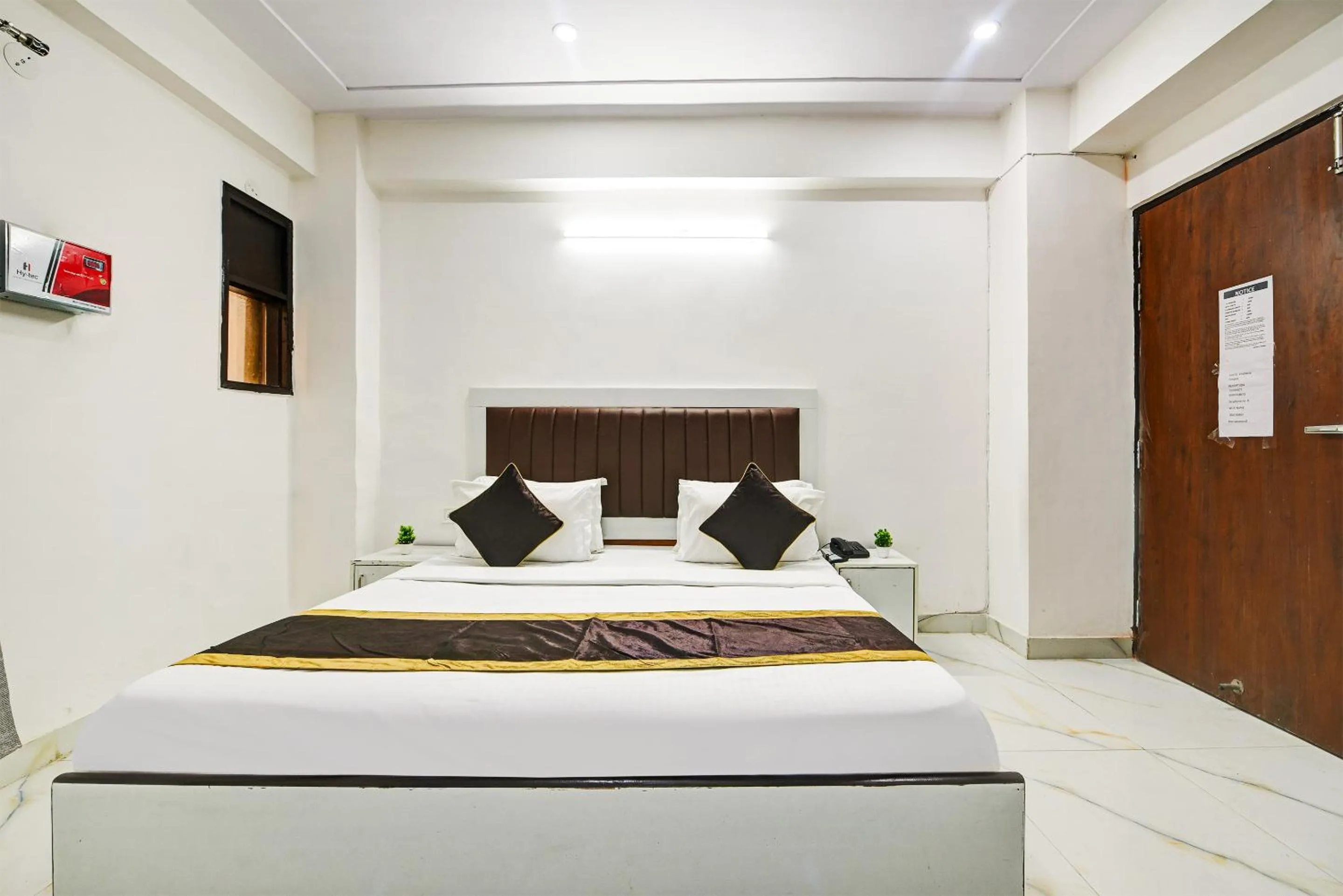 Bed in Hotel Krishna Tower