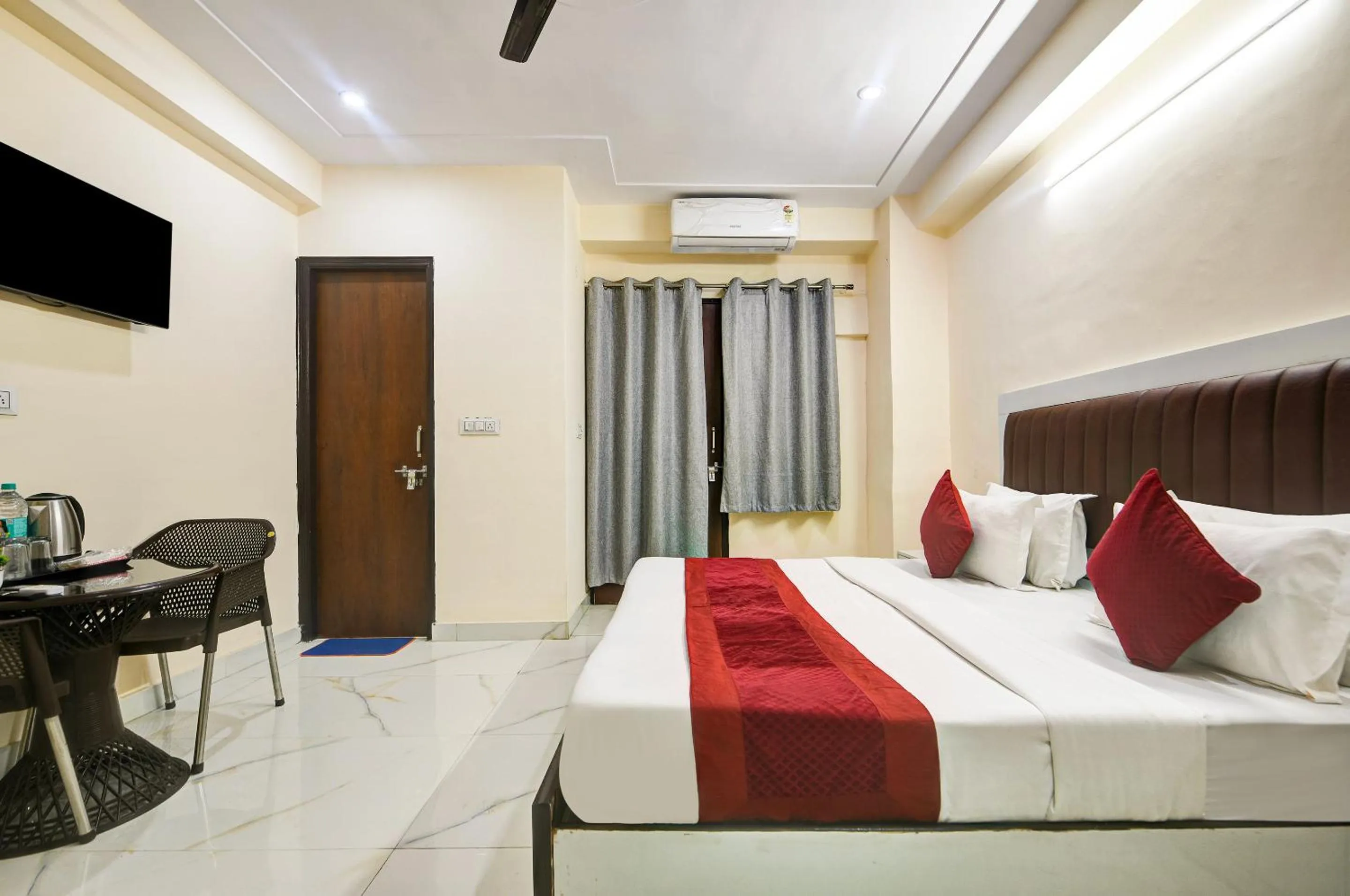 Bed in Hotel Krishna Tower