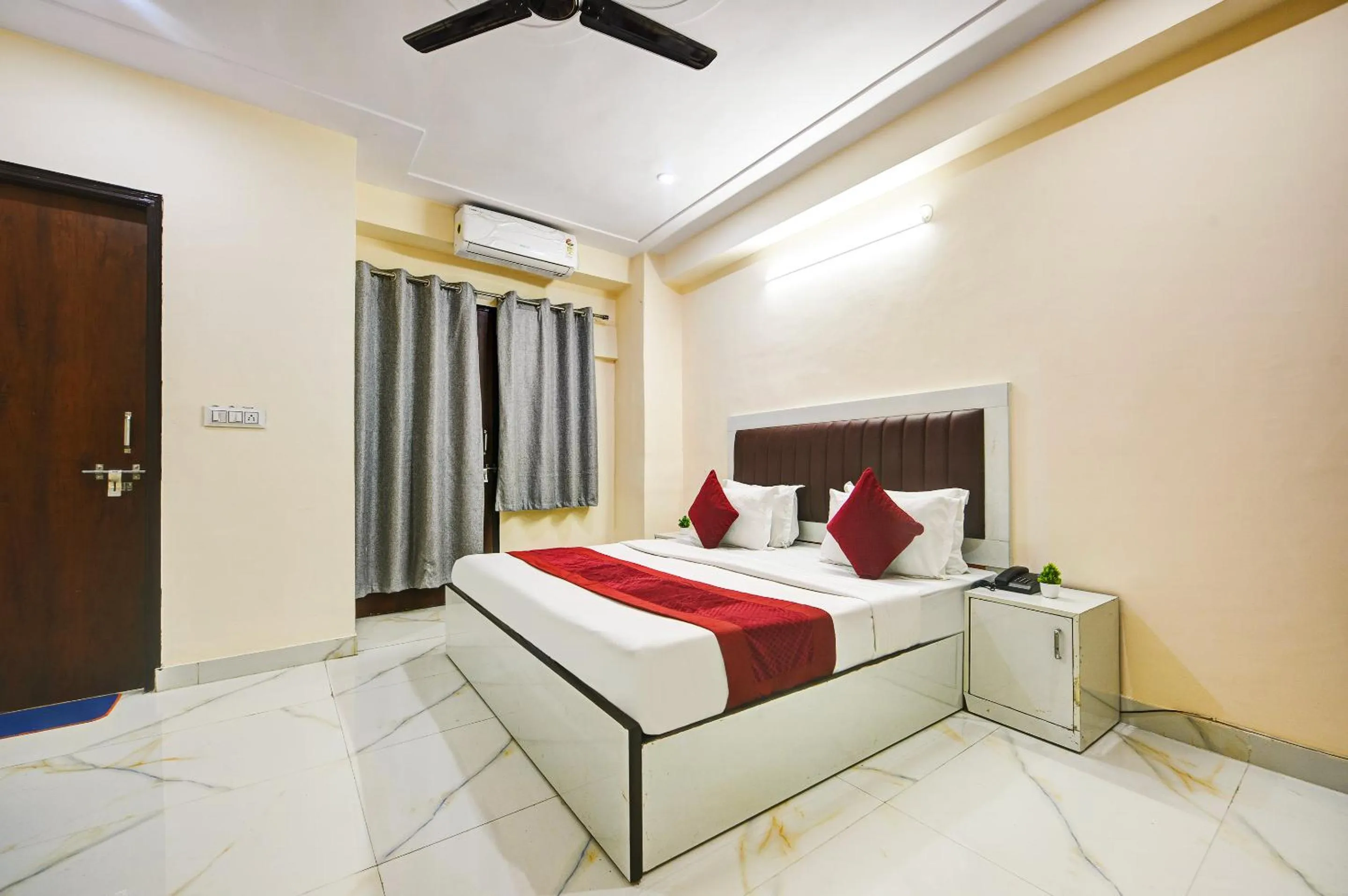 Bed in Hotel Krishna Tower