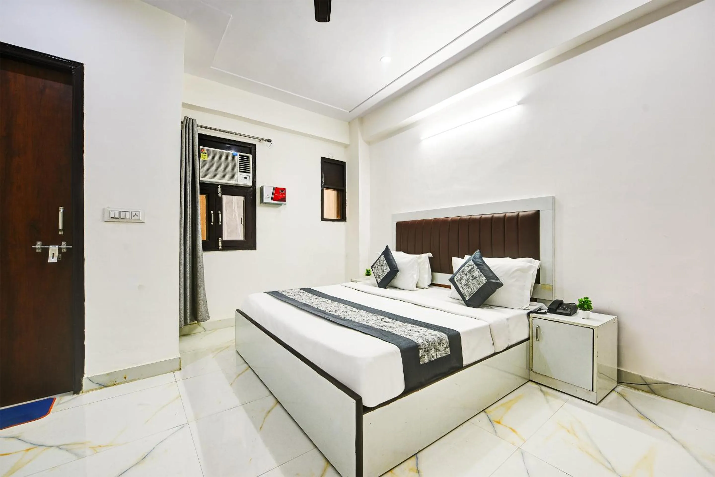 Bed in Hotel Krishna Tower