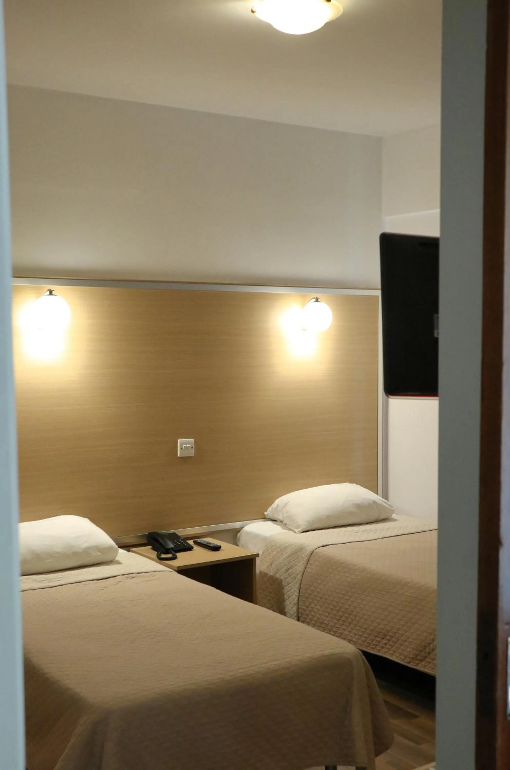 Bed in Layiotis Hotel