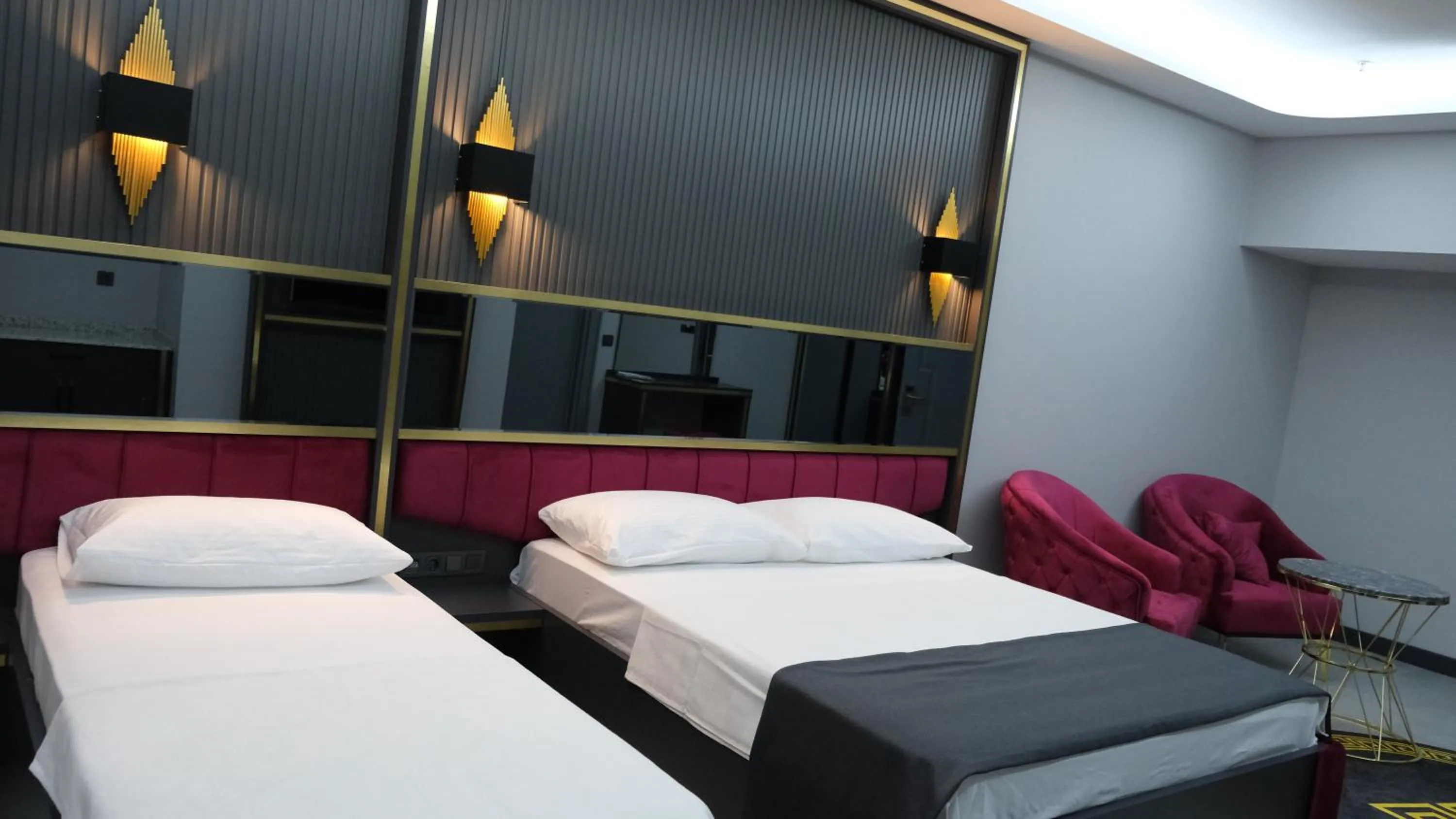 Bed in 216 Prestige Hotel