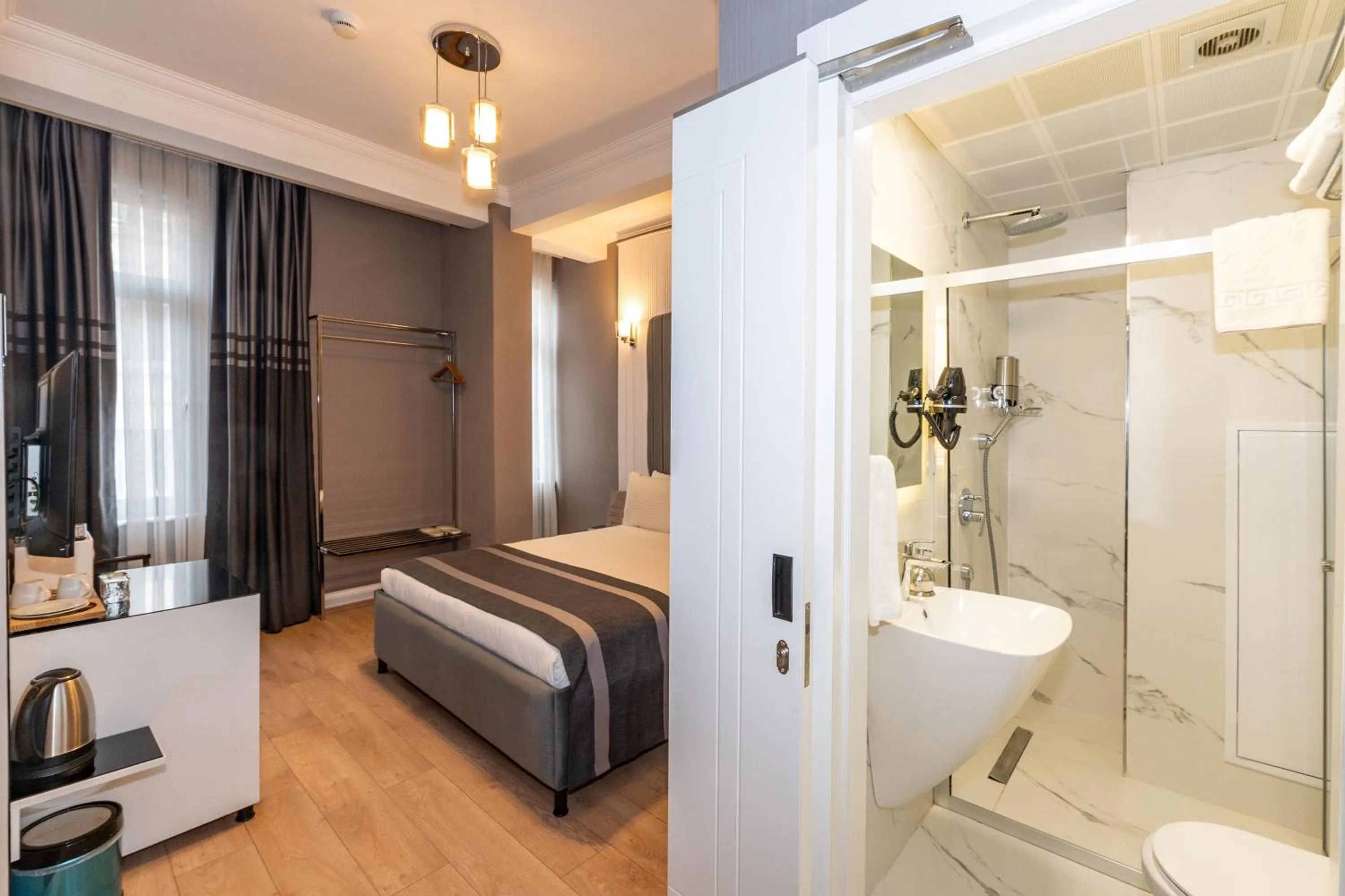 Toilet, Bed in The Now Hotel