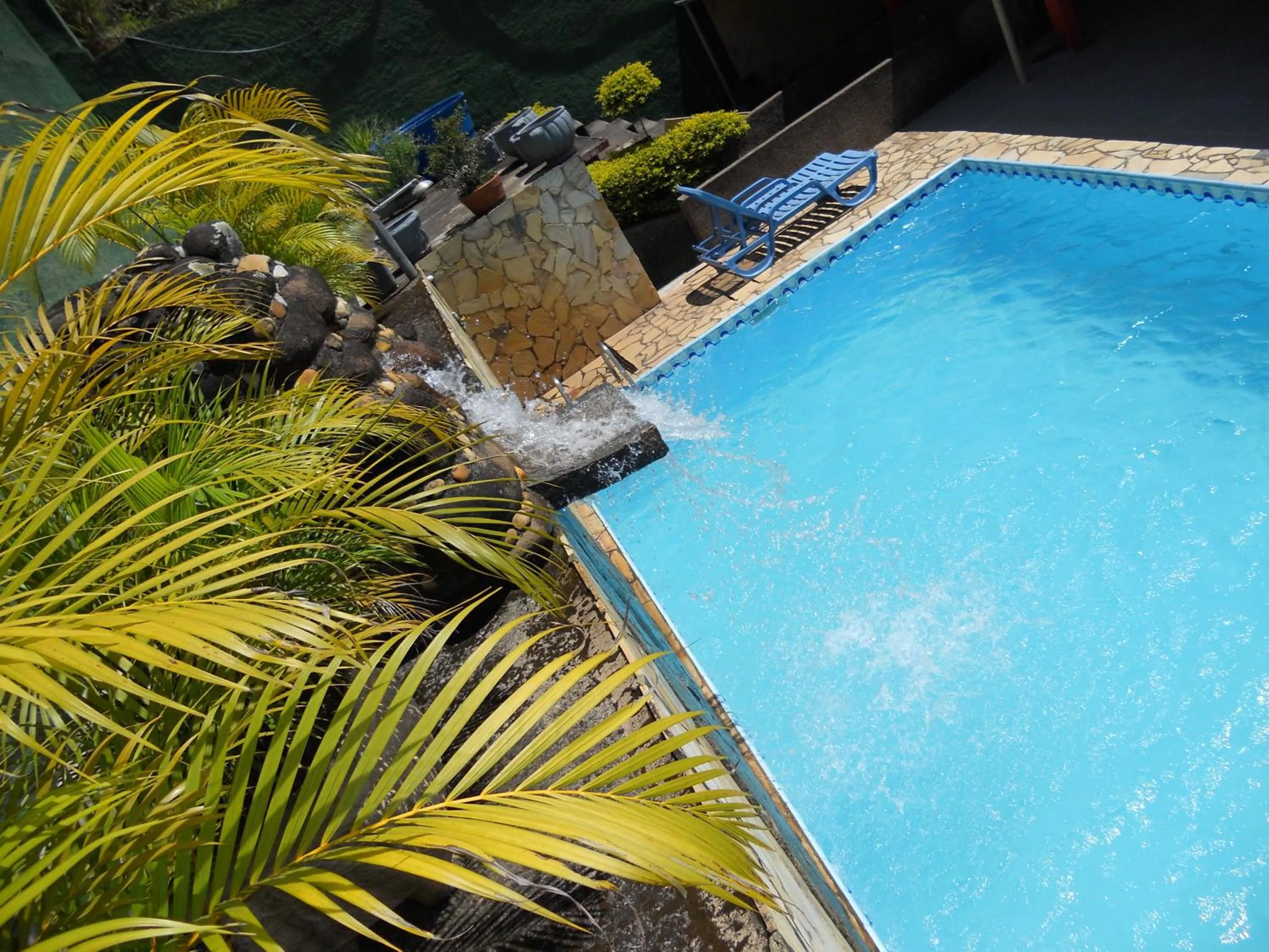 Swimming pool in Pousada O Meu Canto