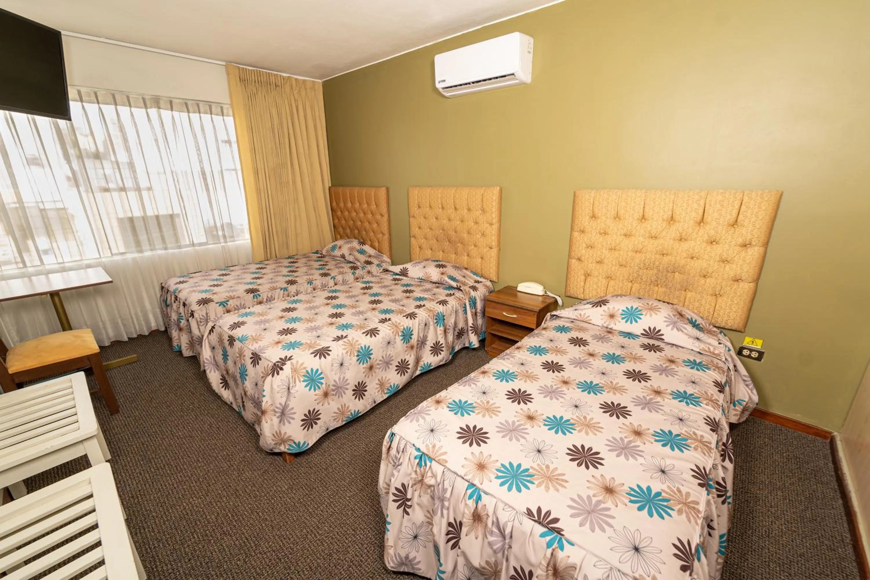 Bed in Hotel San Felipe Suites