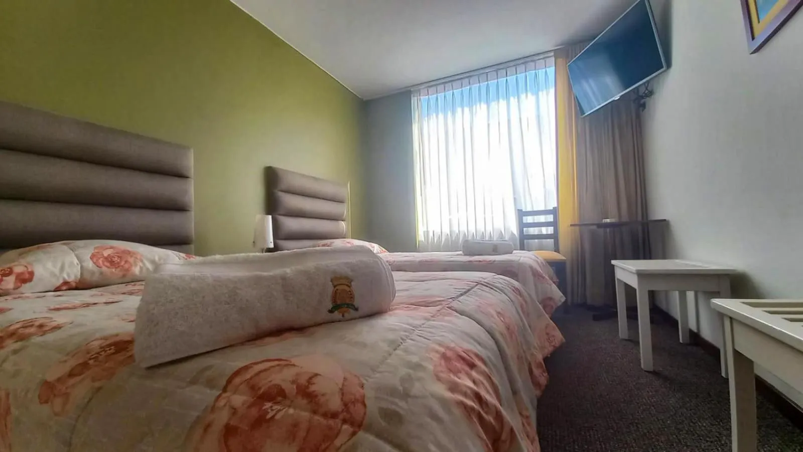 Bed in Hotel San Felipe Suites