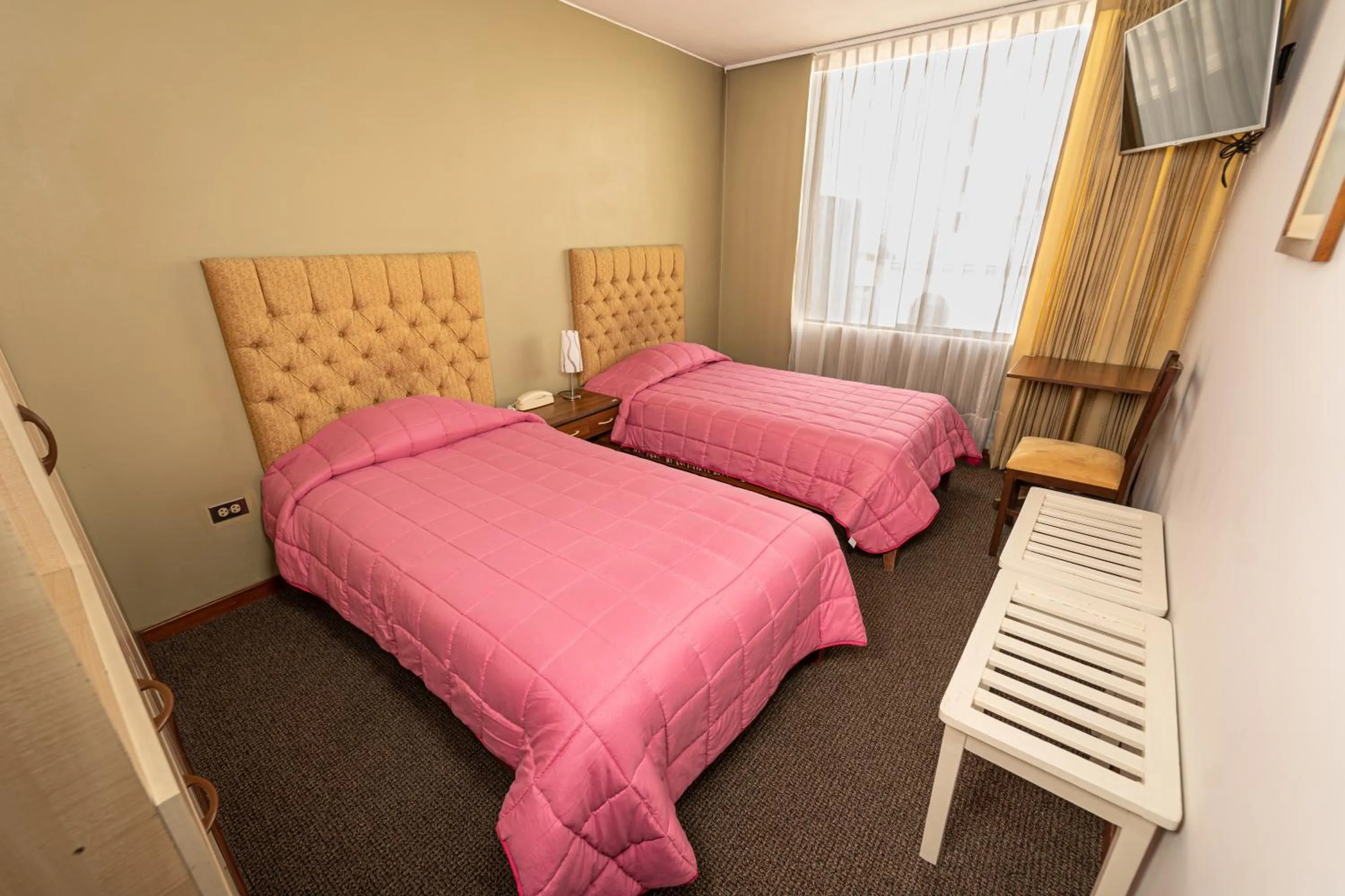 Bed in Hotel San Felipe Suites