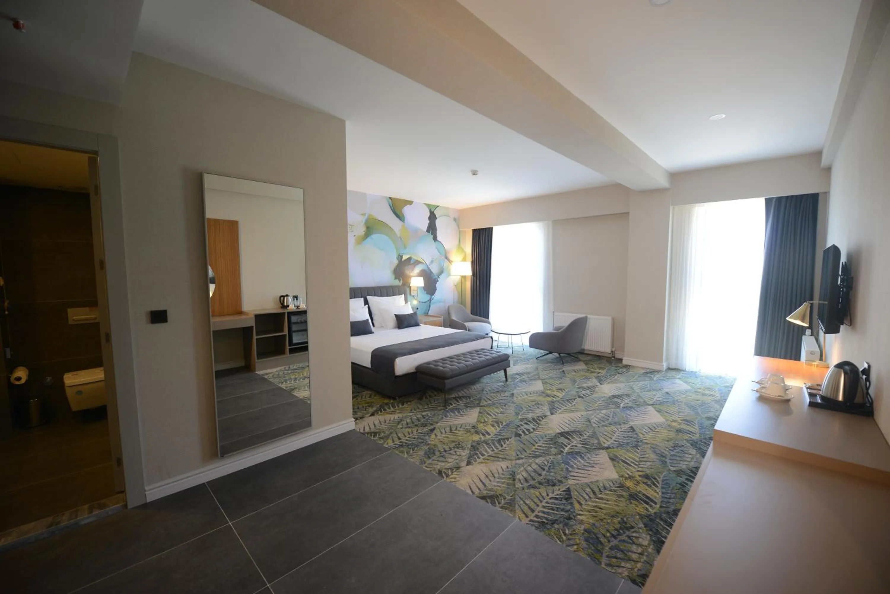 Communal lounge/ TV room, Bed in Wyndham Garden Cambasi