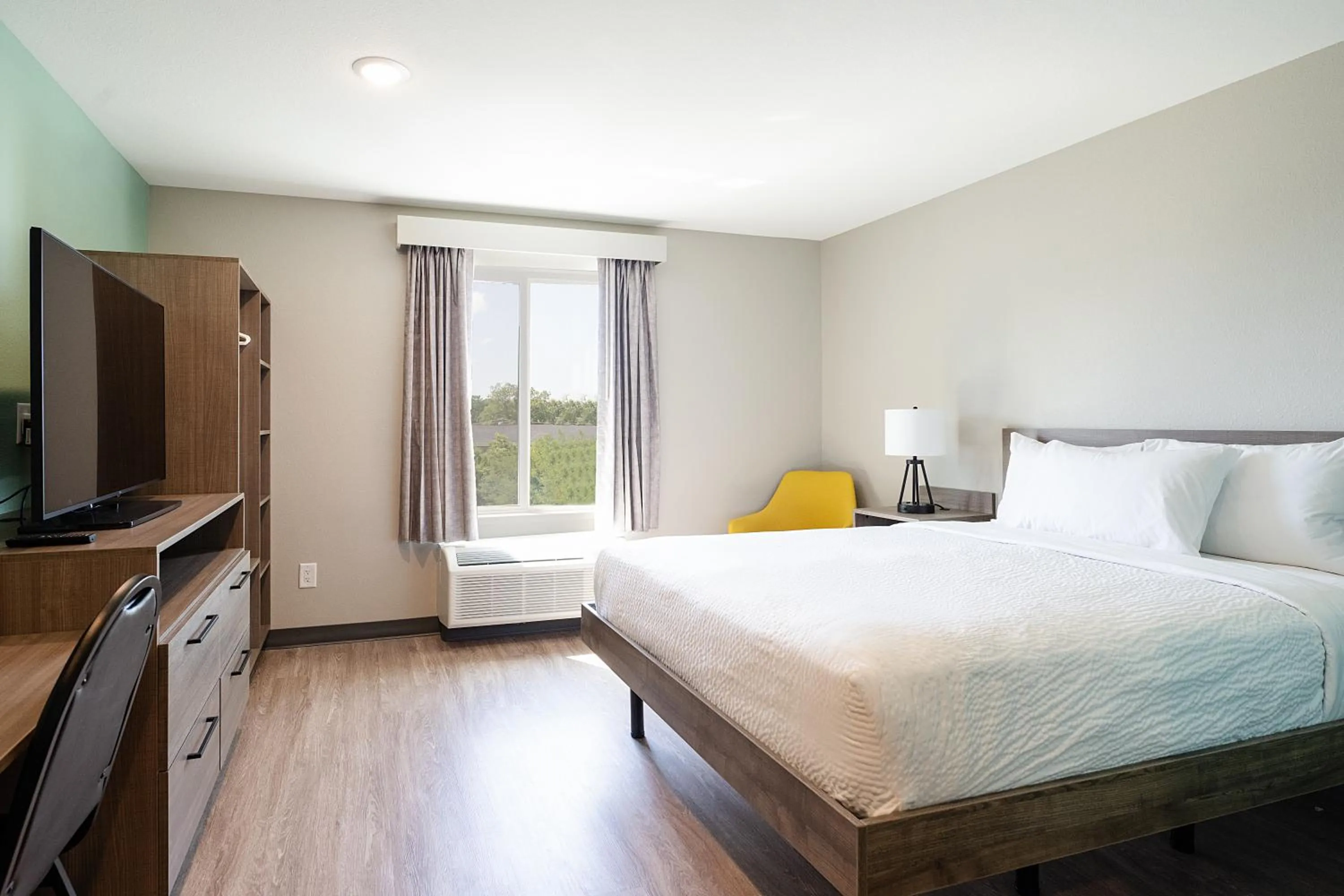 Photo of the whole room, Bed in ECHO Suites Extended Stay by Wyndham Dallas Plano - Frisco