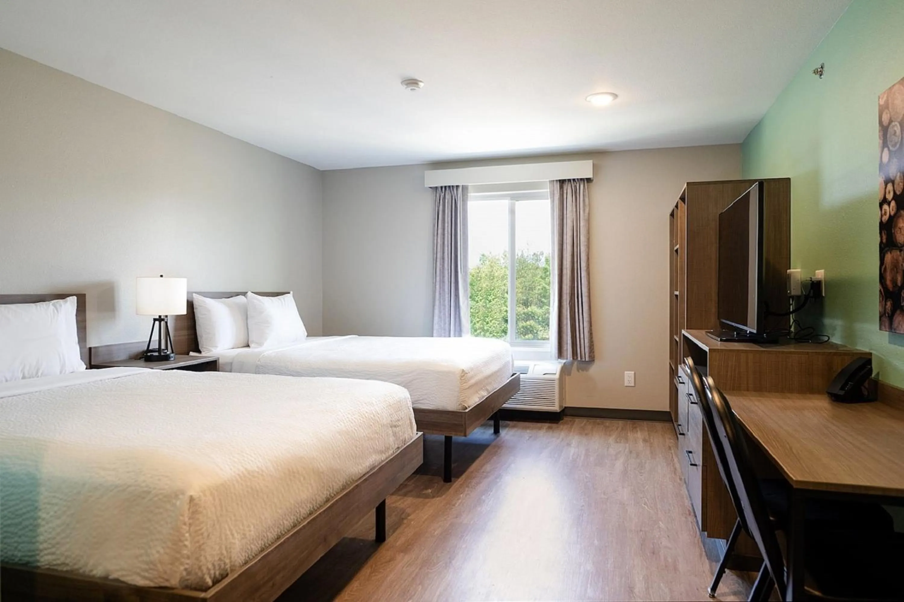 Photo of the whole room, Bed in ECHO Suites Extended Stay by Wyndham Dallas Plano - Frisco