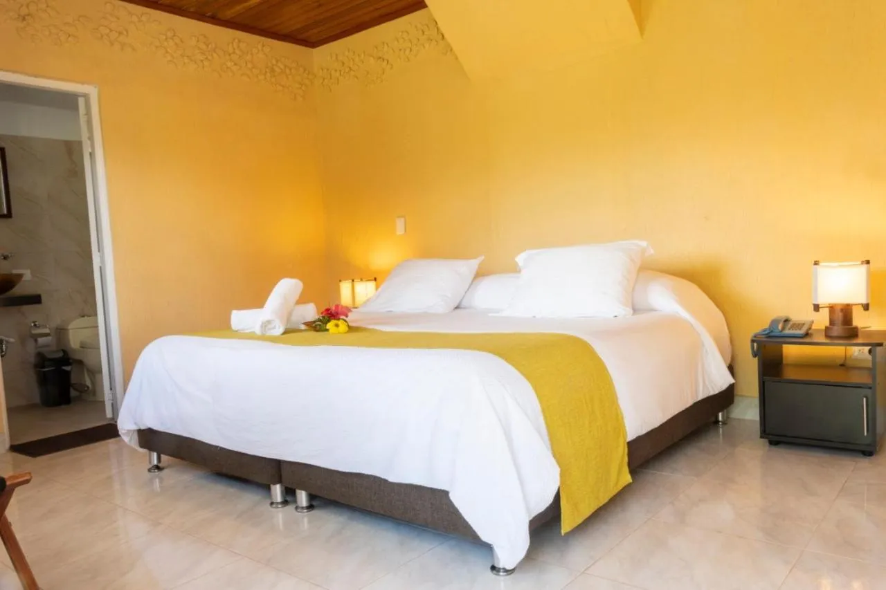 Bed in San Agustin Internacional Hotel
