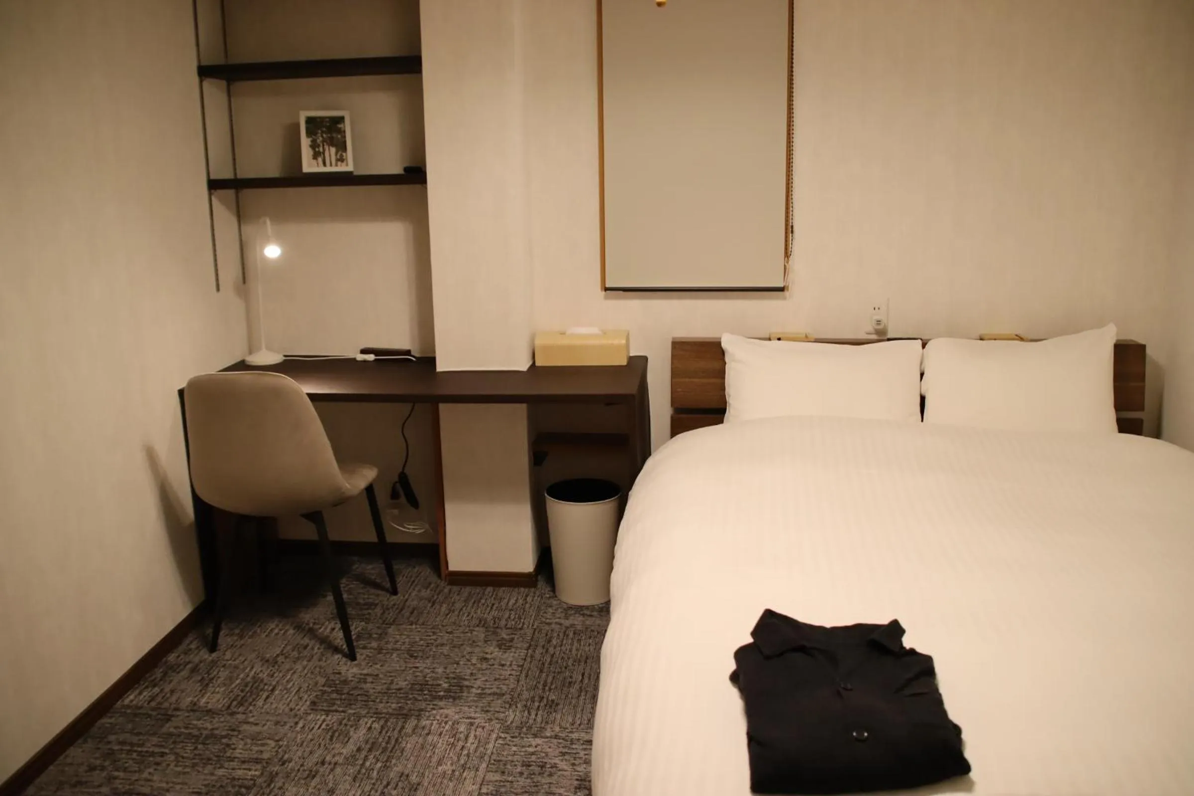 Bed in ritomaru rooms hakata hakozaki