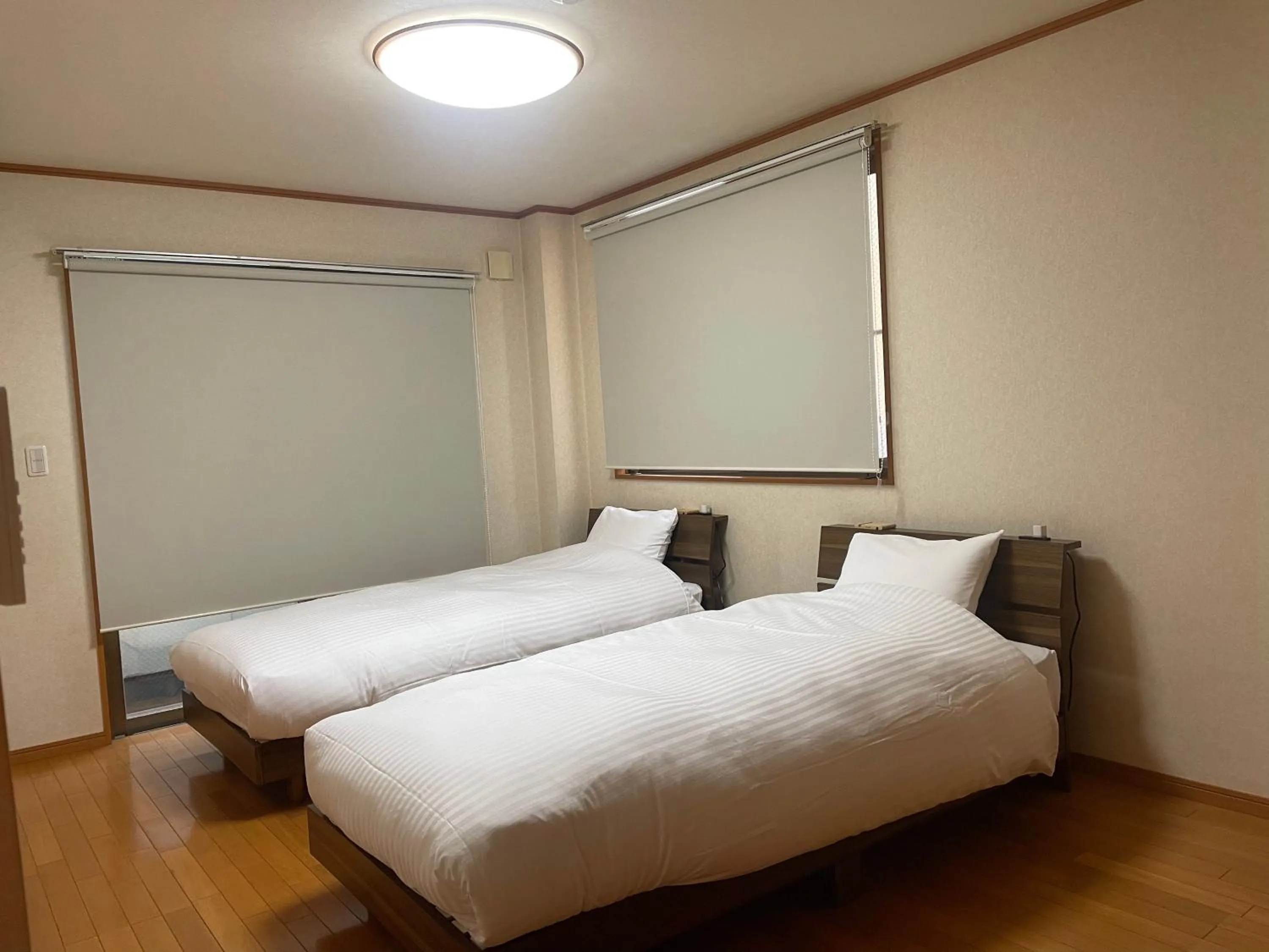 Bed in ritomaru rooms hakata hakozaki