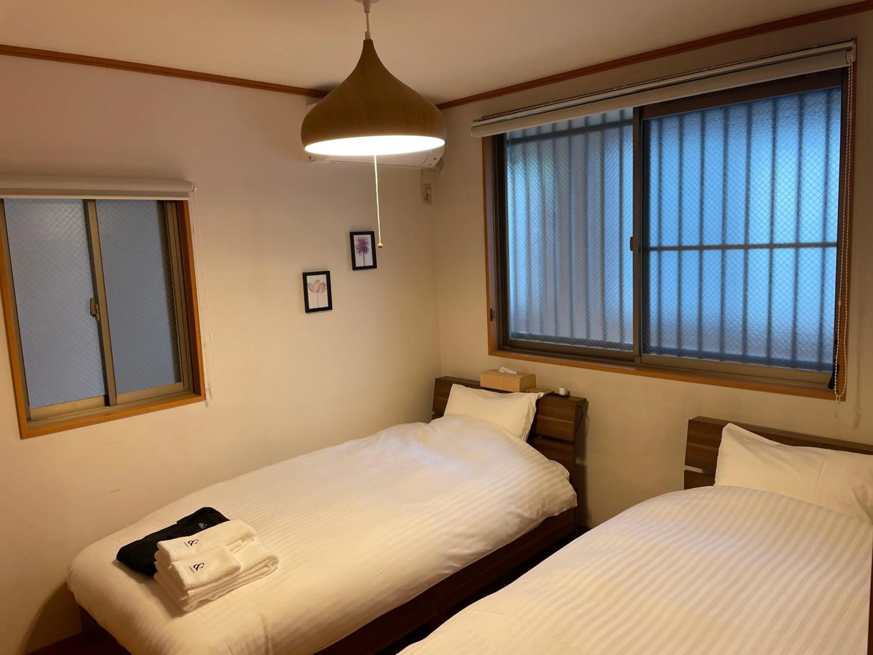 Bed in ritomaru rooms hakata hakozaki